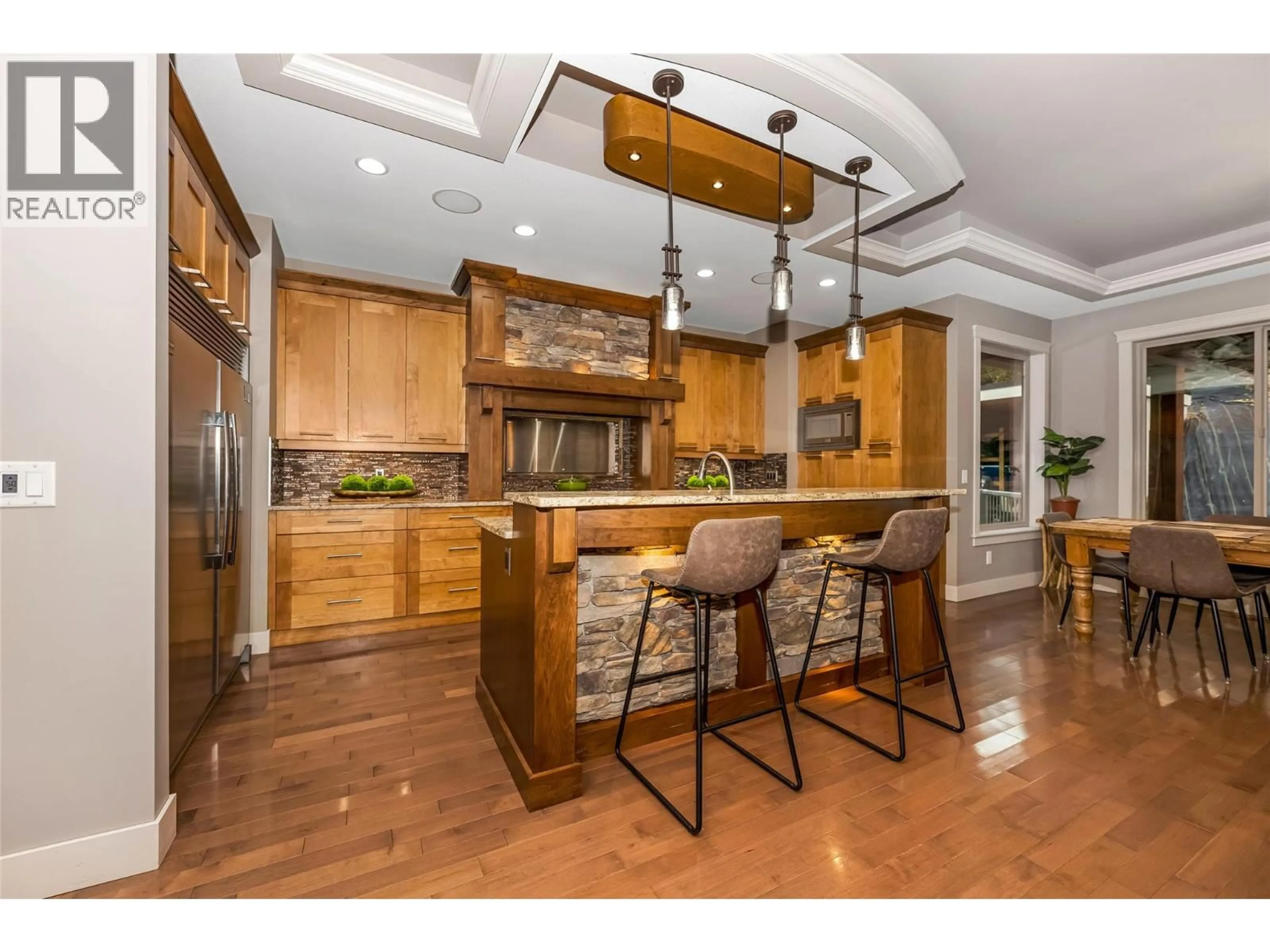 Open concept kitchen, wood/laminate floor for 1998 HIDDEN RIDGE PLACE, Kelowna British Columbia V1V2X8