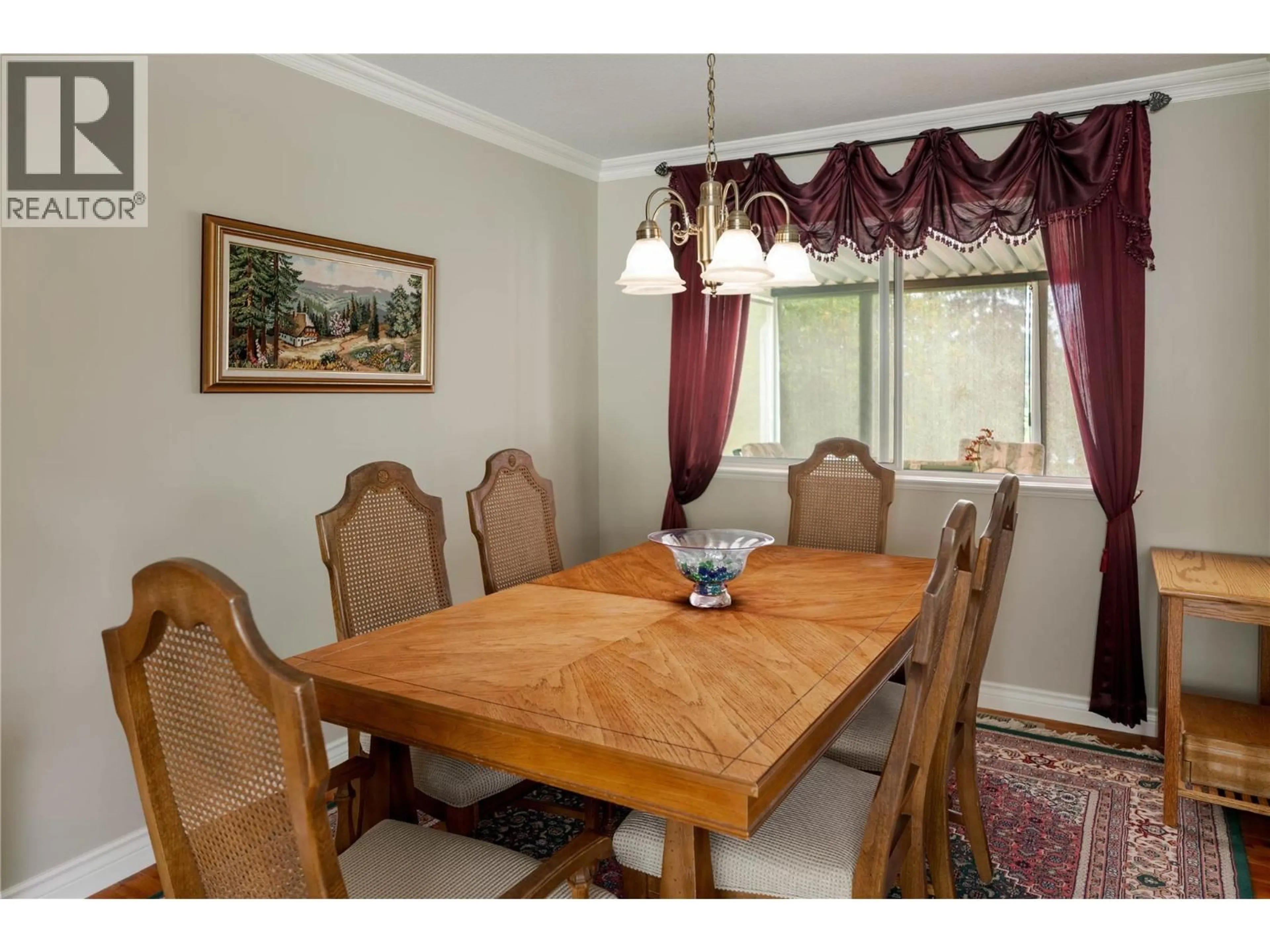 Dining room, wood/laminate floor for 3942 SUNCREST COURT, Kelowna British Columbia V1W4E8