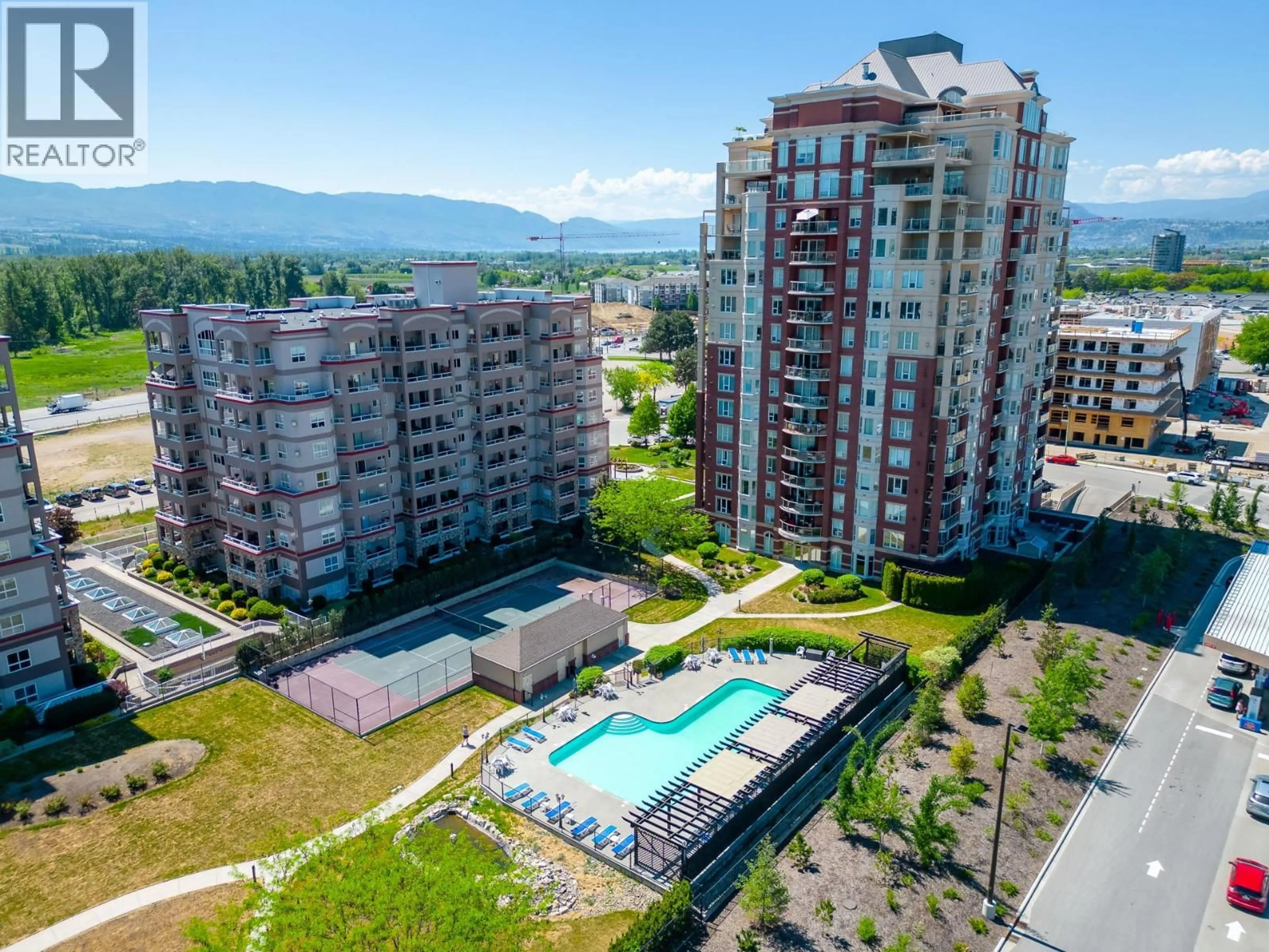 A pic from outside/outdoor area/front of a property/back of a property/a pic from drone, mountain view for 704 - 1947 UNDERHILL STREET, Kelowna British Columbia V1X7Z5