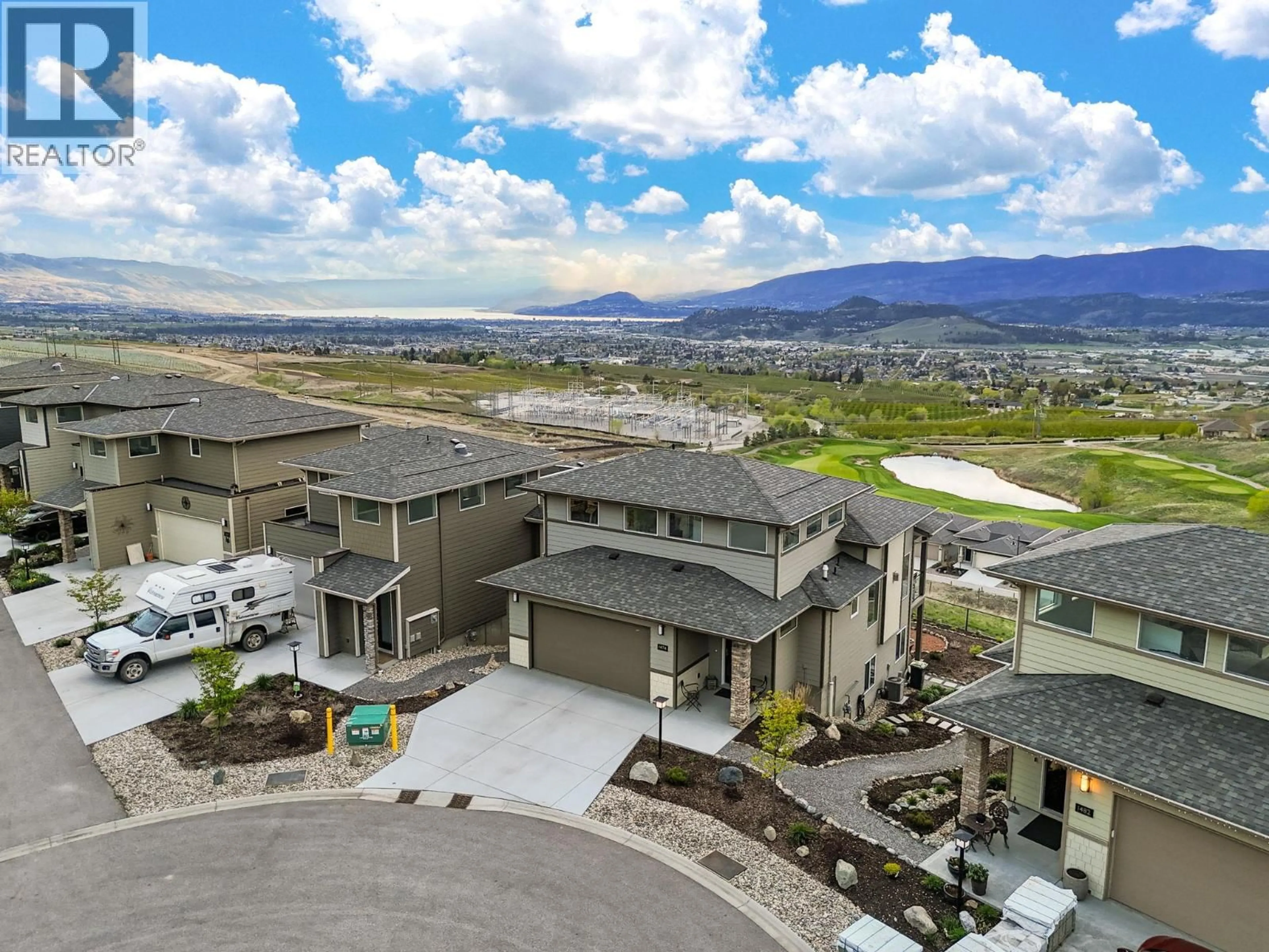 A pic from outside/outdoor area/front of a property/back of a property/a pic from drone, mountain view for 1474 SUMMER CRESCENT, Kelowna British Columbia V1P1T8