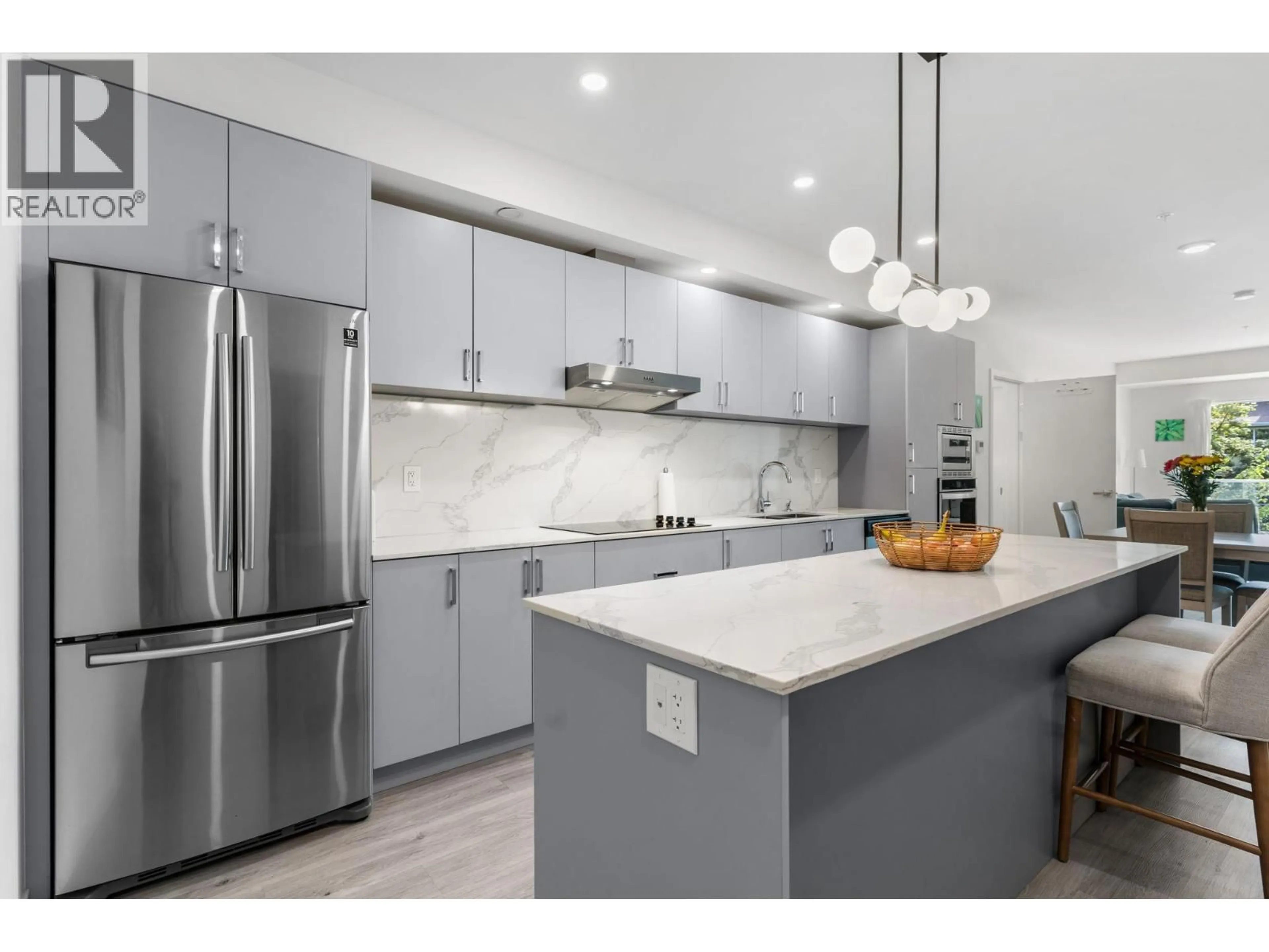 Open concept kitchen, ceramic/tile floor for 207 - 880 SAUCIER AVENUE, Kelowna British Columbia V1Y6A3