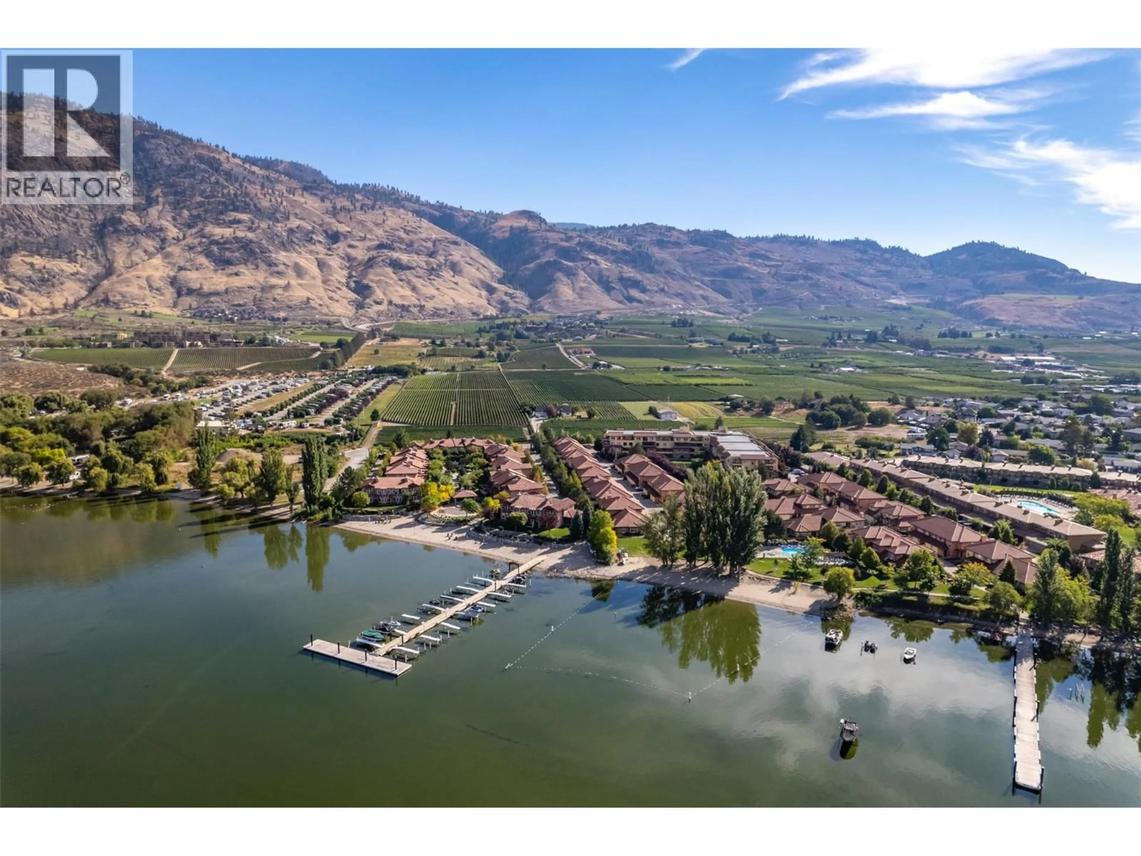 A pic from outside/outdoor area/front of a property/back of a property/a pic from drone, water/lake/river/ocean view for 404 - 7600 COTTONWOOD DRIVE, Osoyoos British Columbia V0H1V0