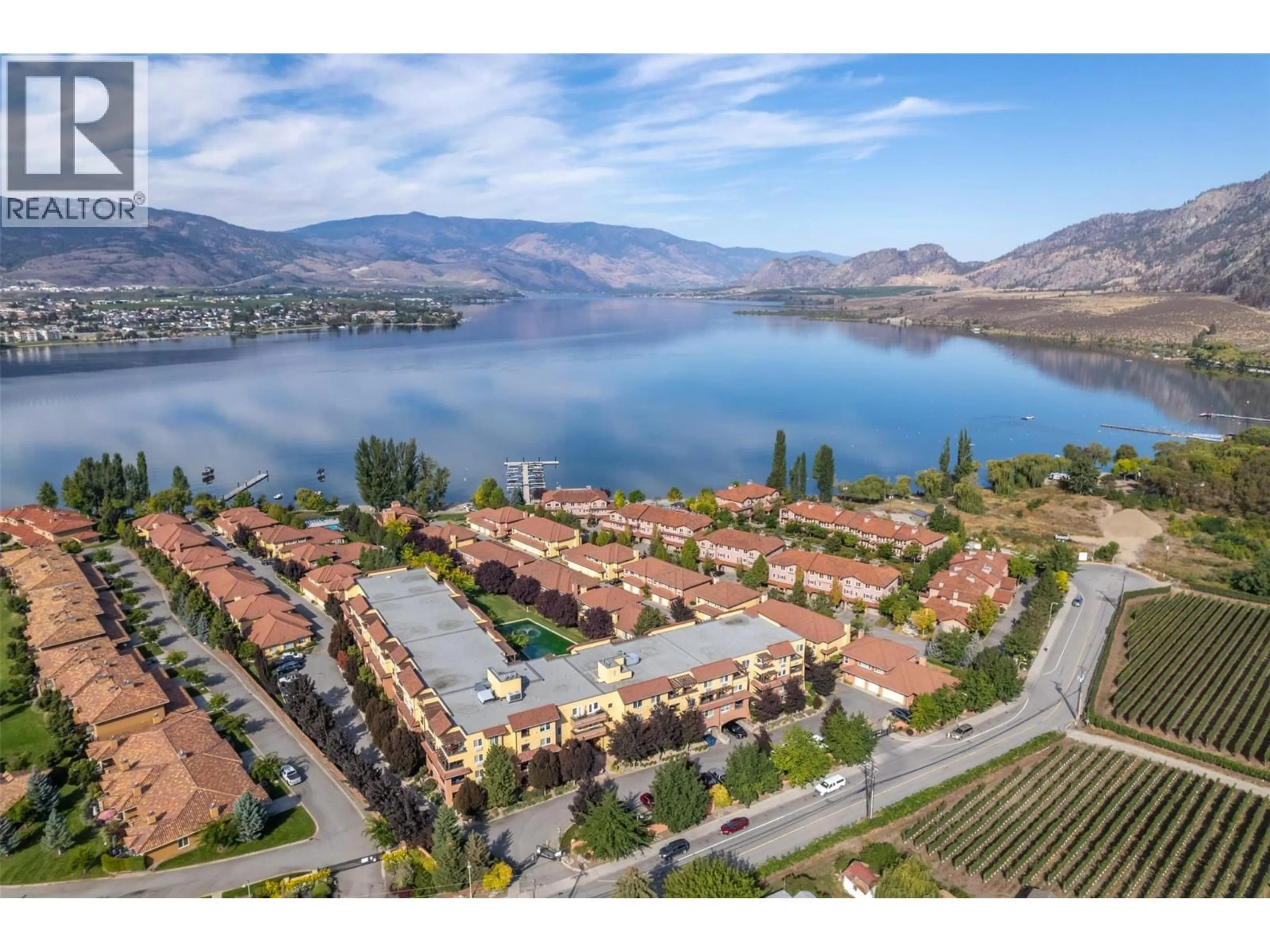 A pic from outside/outdoor area/front of a property/back of a property/a pic from drone, water/lake/river/ocean view for 404 - 7600 COTTONWOOD DRIVE, Osoyoos British Columbia V0H1V0