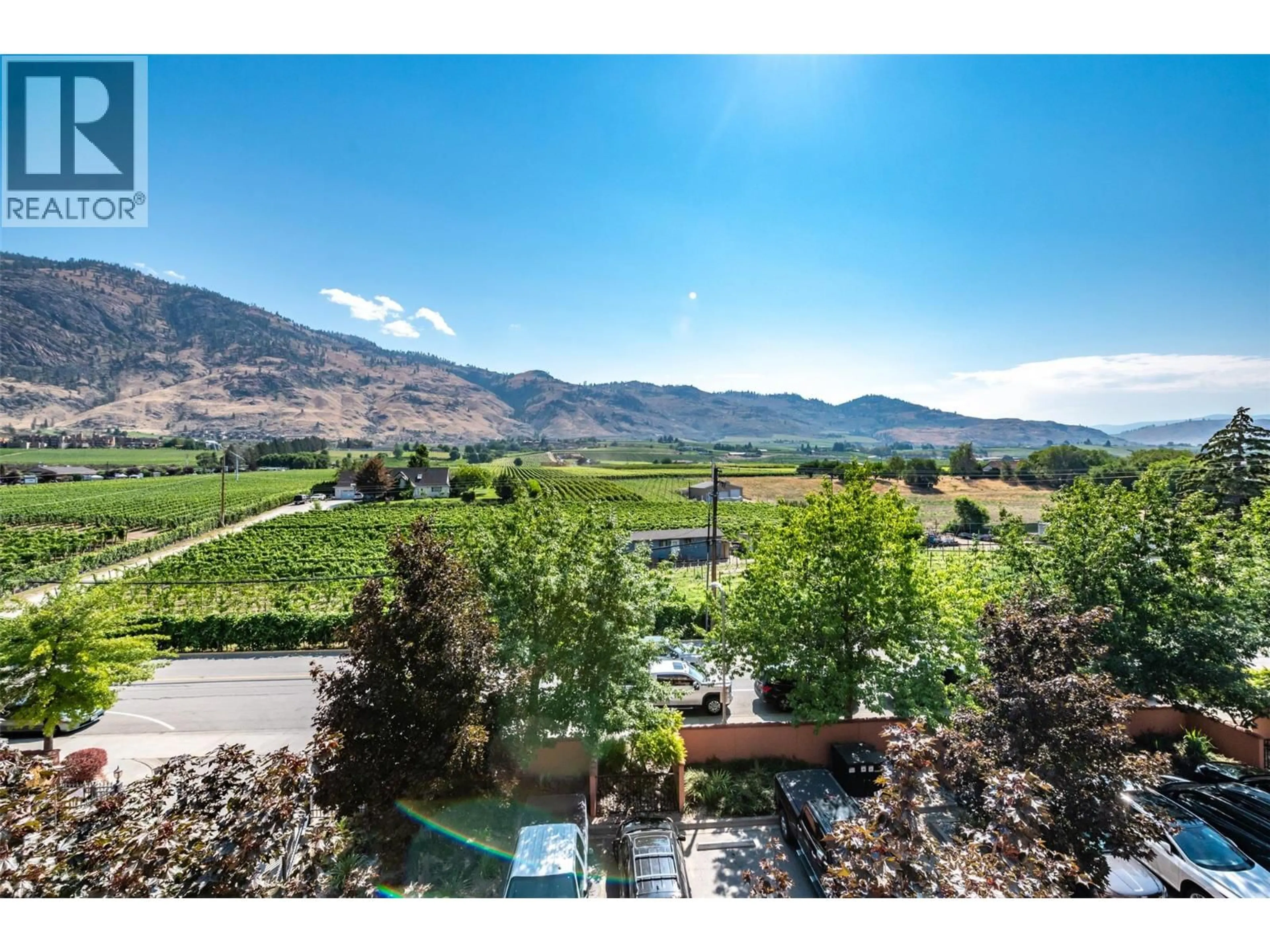 A pic from outside/outdoor area/front of a property/back of a property/a pic from drone, mountain view for 404 - 7600 COTTONWOOD DRIVE, Osoyoos British Columbia V0H1V0