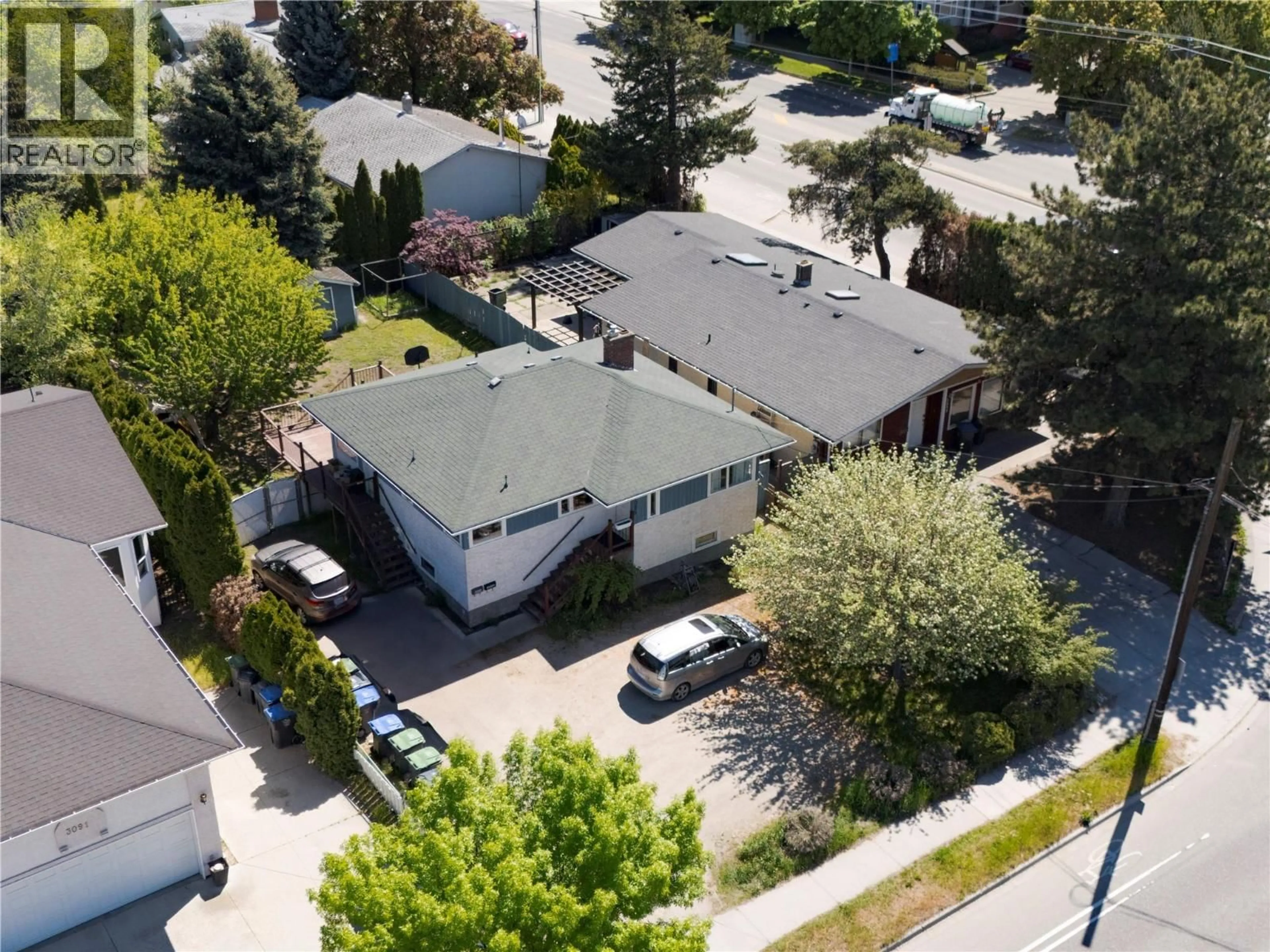 A pic from outside/outdoor area/front of a property/back of a property/a pic from drone, street for 3095 GORDON DRIVE, Kelowna British Columbia V1W3R1