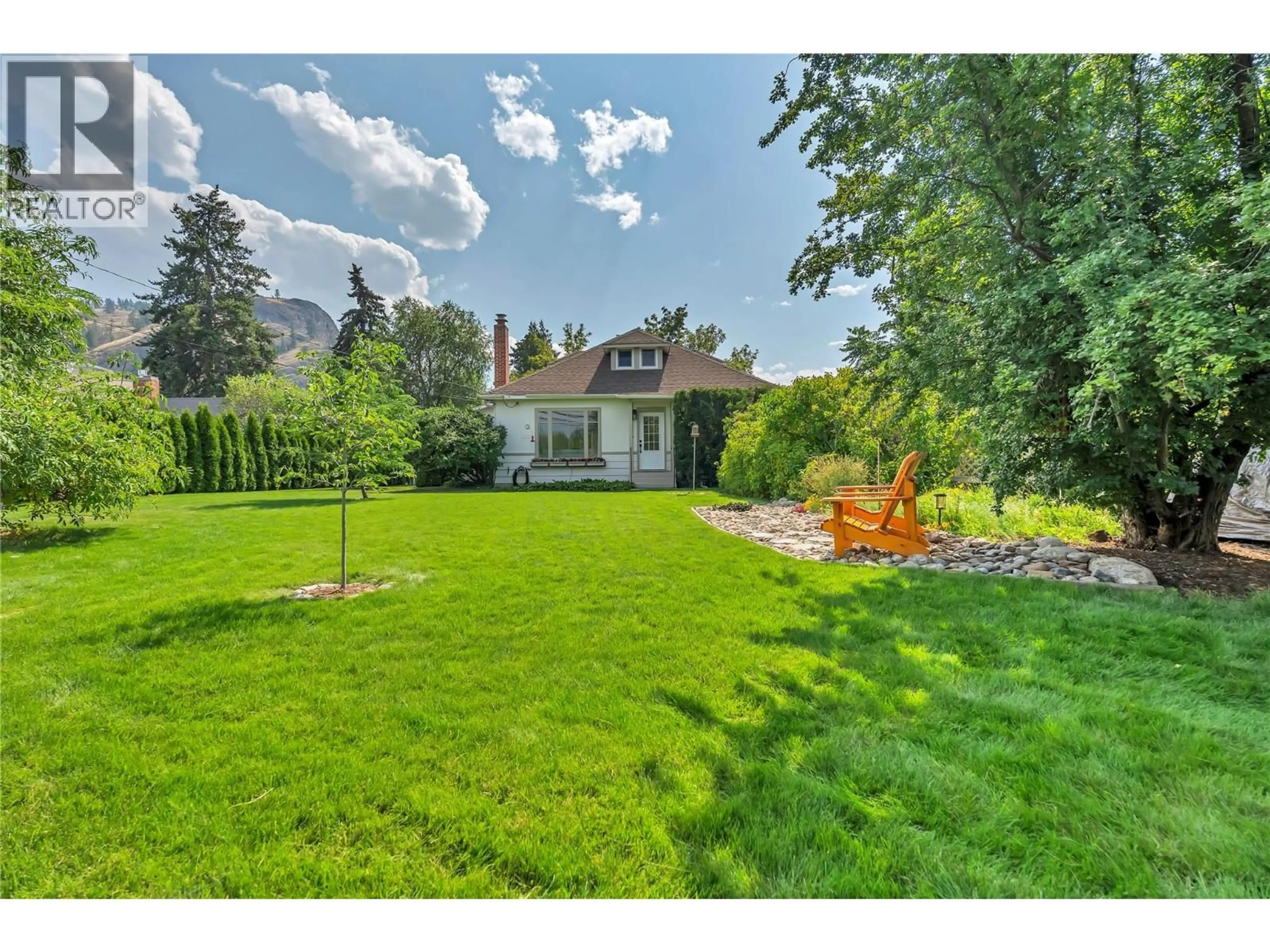 A pic from outside/outdoor area/front of a property/back of a property/a pic from drone, street for 12432 VICTORIA ROAD SOUTH, Summerland British Columbia V0H1Z0