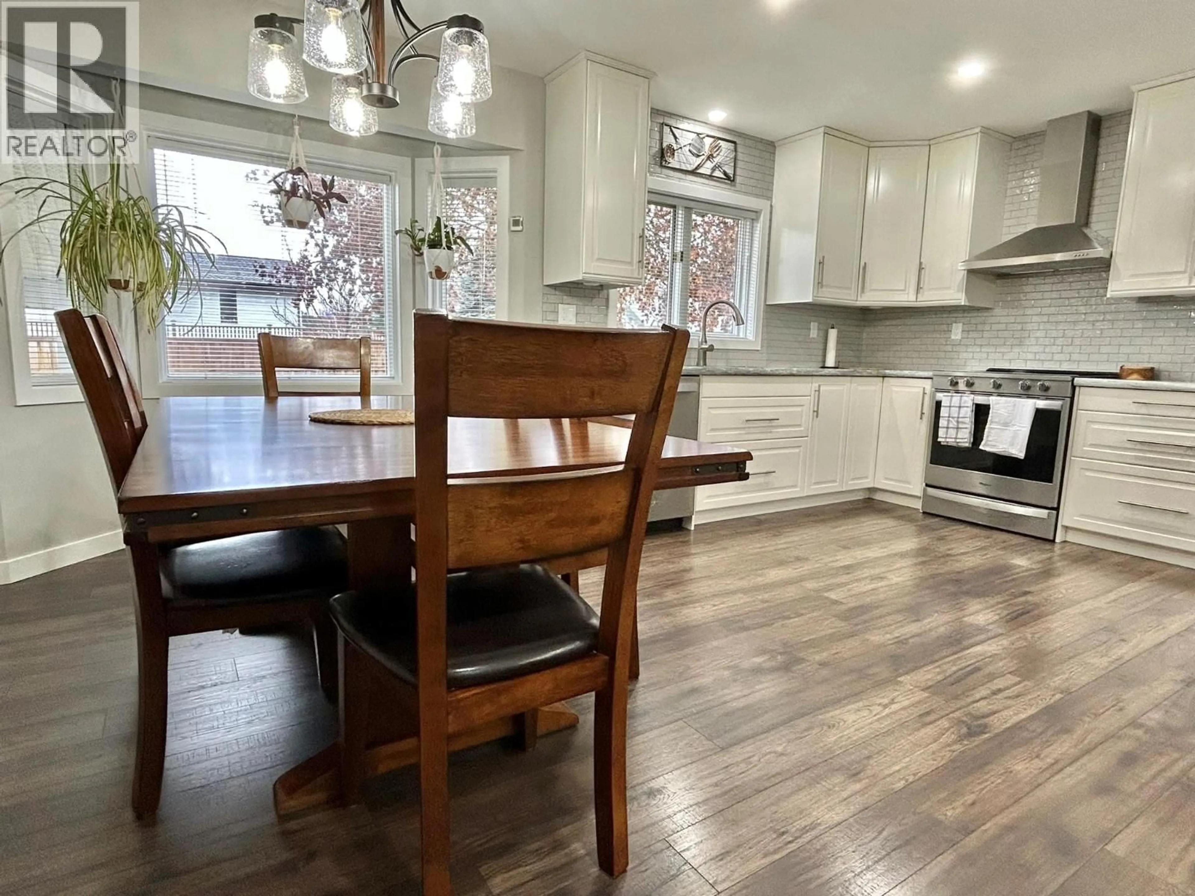 Open concept kitchen, wood/laminate floor for 1884 COALSHUTE ROAD, Grand Forks British Columbia V0H1H2