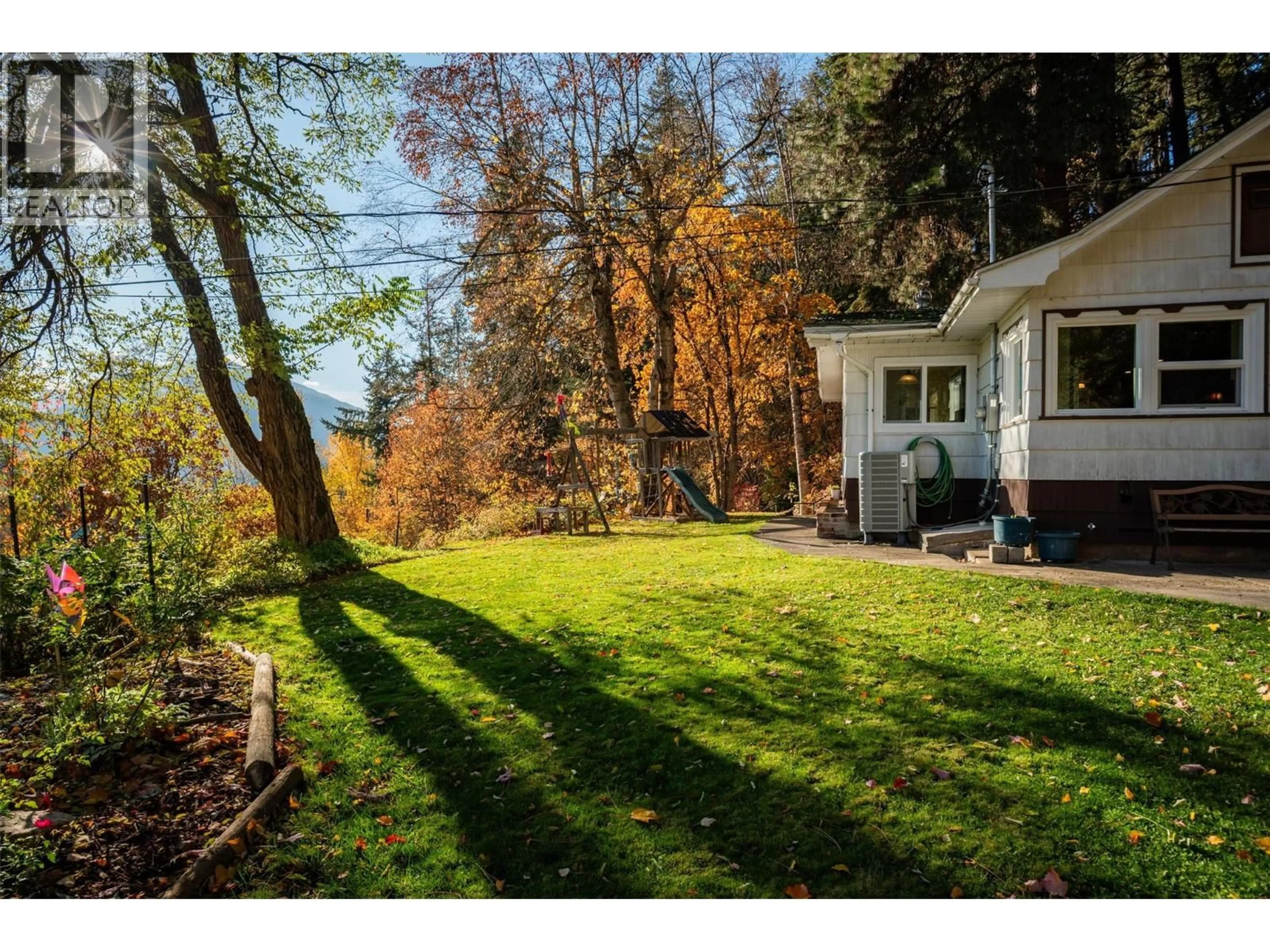 A pic from outside/outdoor area/front of a property/back of a property/a pic from drone, forest/trees view for 3175 BAKER ROAD, South Slocan British Columbia V0G2G1