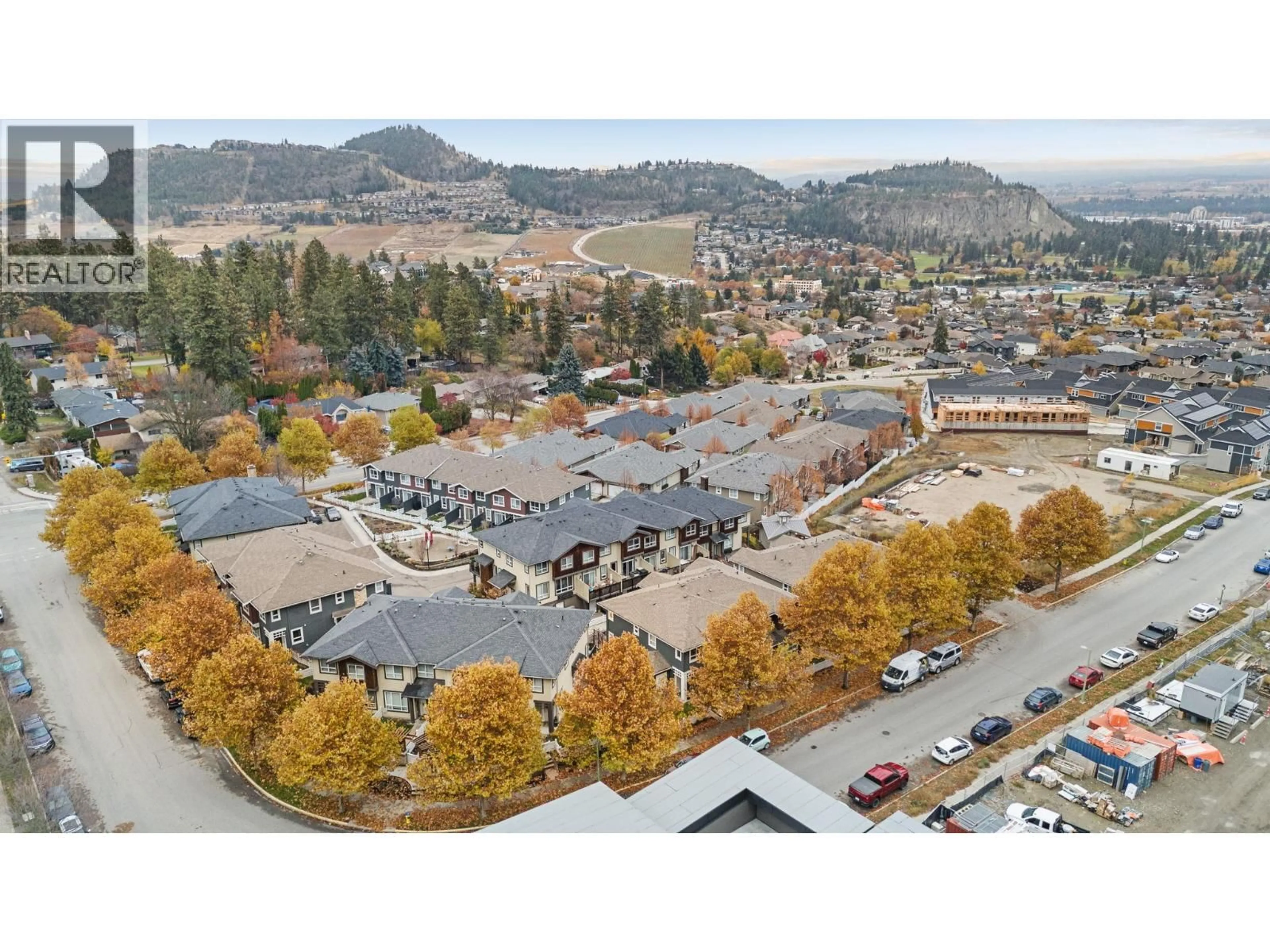A pic from outside/outdoor area/front of a property/back of a property/a pic from drone, mountain view for 613 BOYNTON PLACE, Kelowna British Columbia V1V3B5