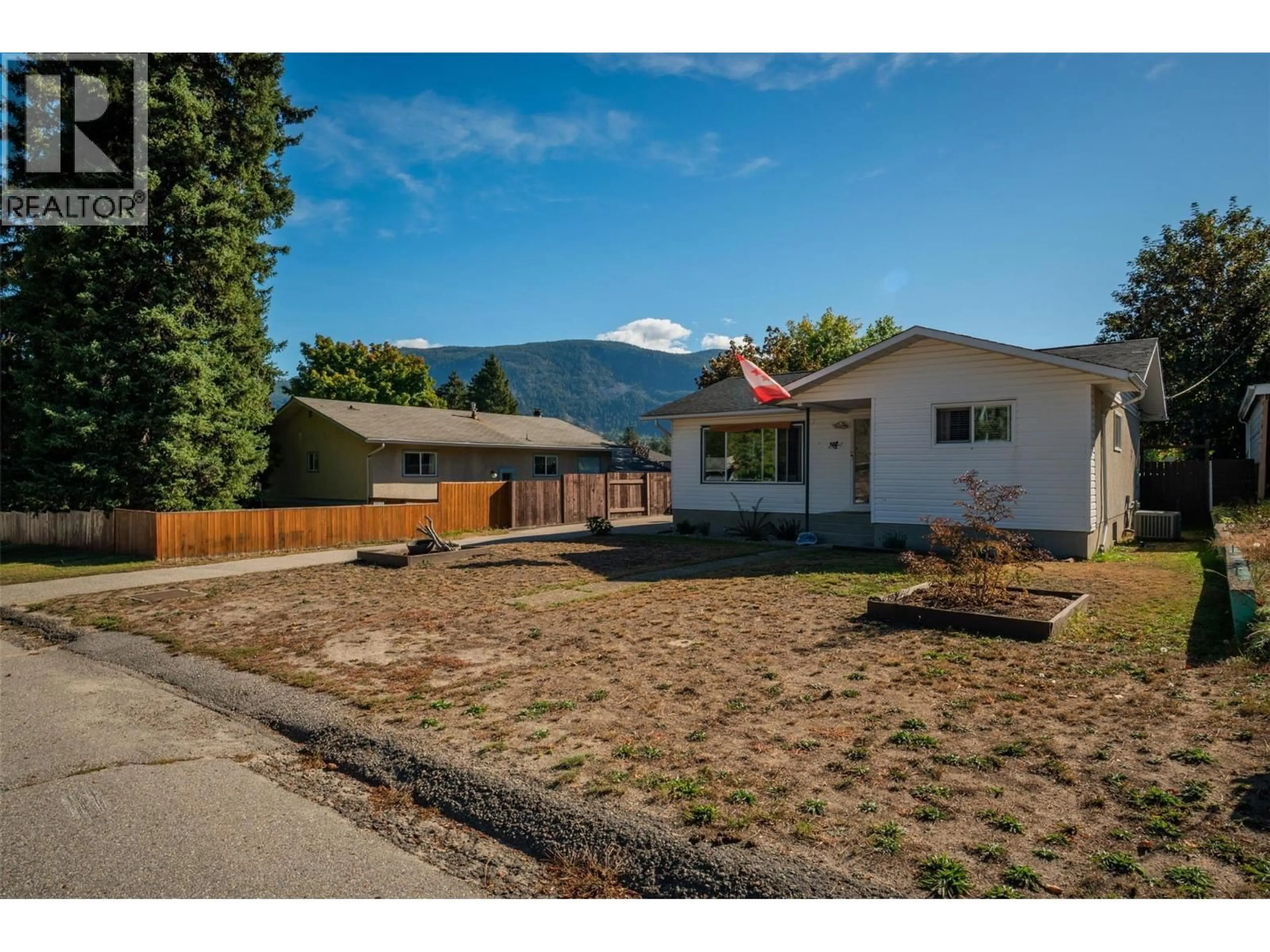 A pic from outside/outdoor area/front of a property/back of a property/a pic from drone, mountain view for 204 PINEWOOD DRIVE, Castlegar British Columbia V1N2M4
