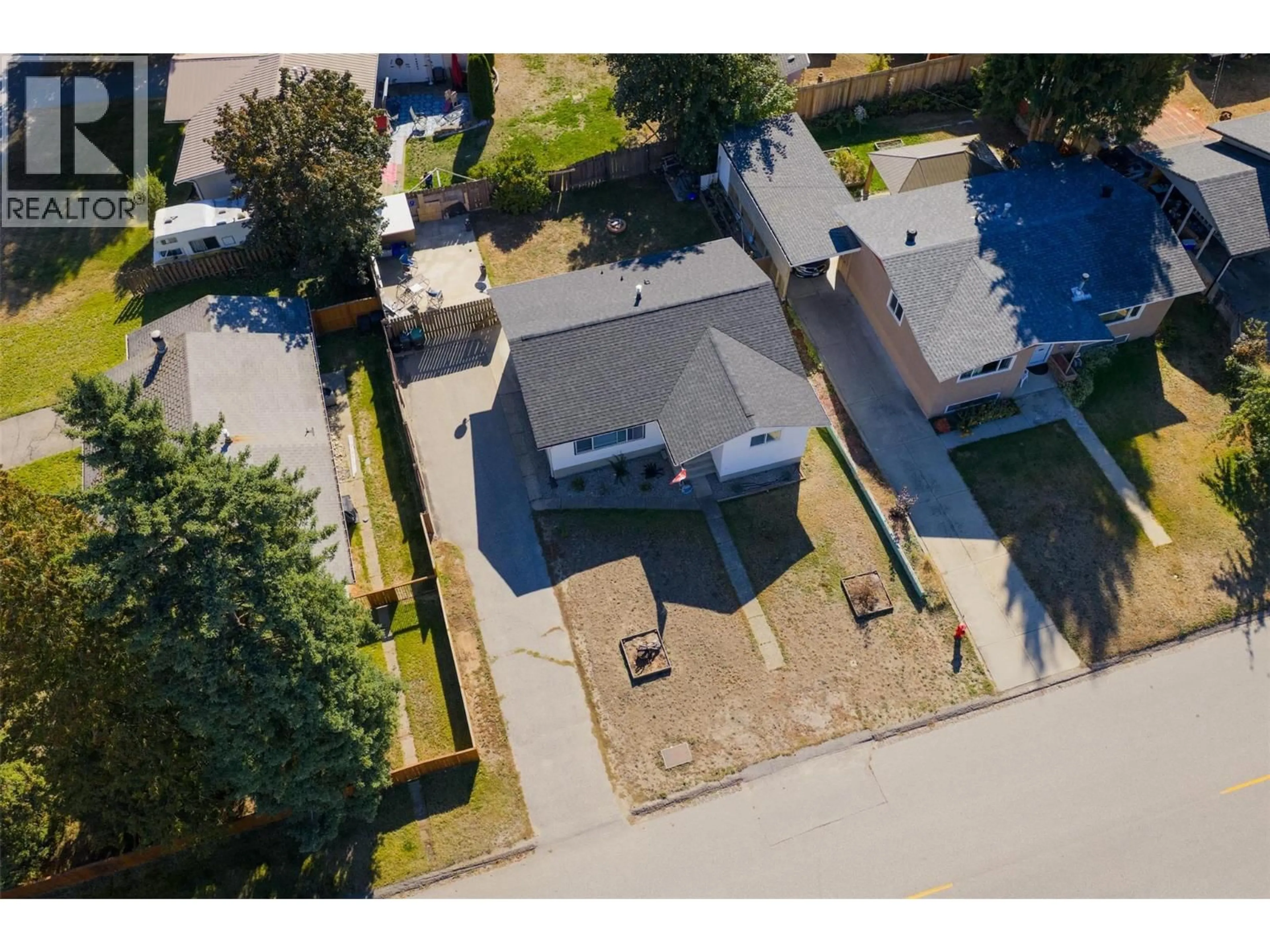 A pic from outside/outdoor area/front of a property/back of a property/a pic from drone, street for 204 PINEWOOD DRIVE, Castlegar British Columbia V1N2M4