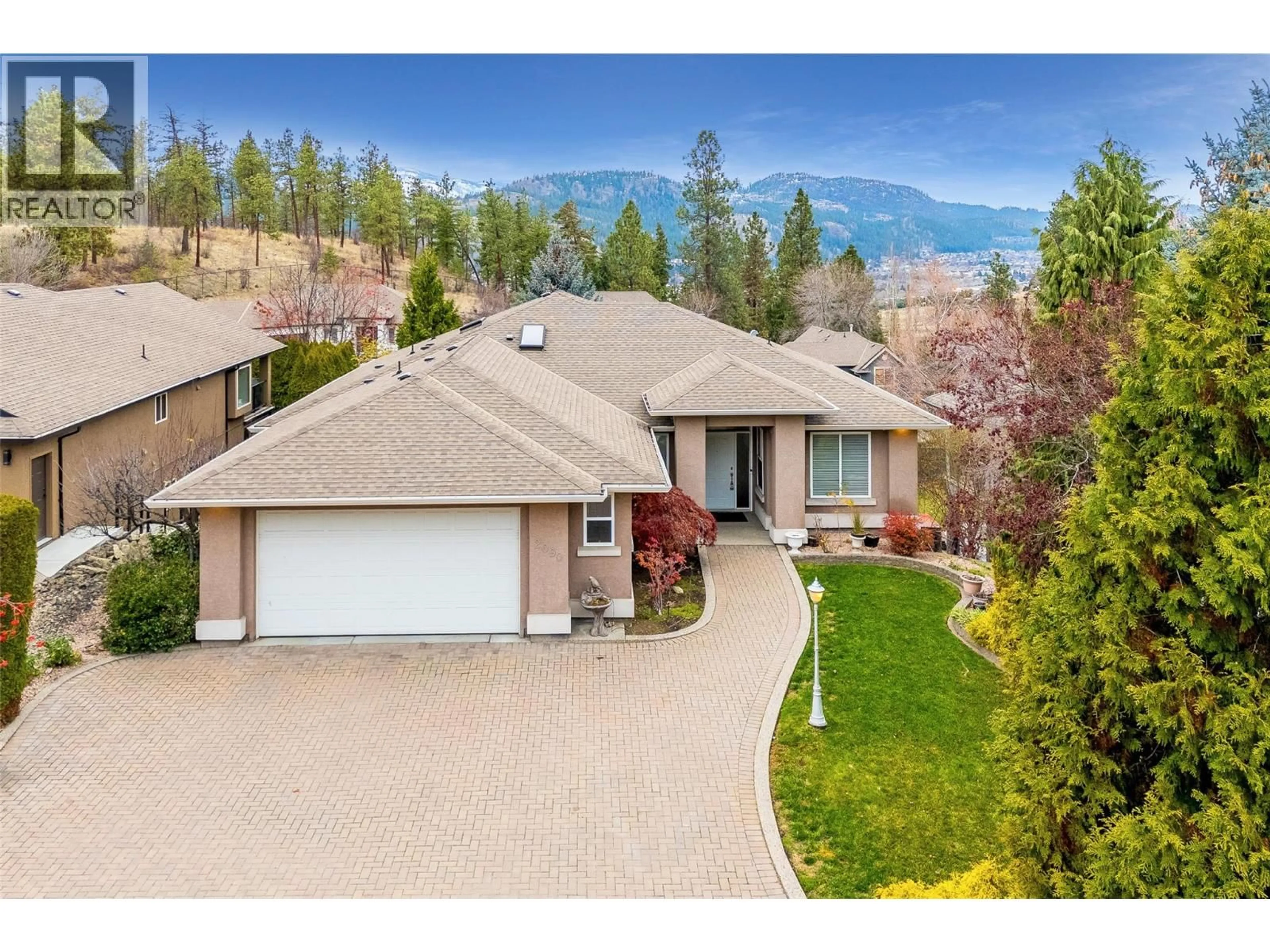 A pic from outside/outdoor area/front of a property/back of a property/a pic from drone, mountain view for 2090 BOWRON STREET, Kelowna British Columbia V1V2P2