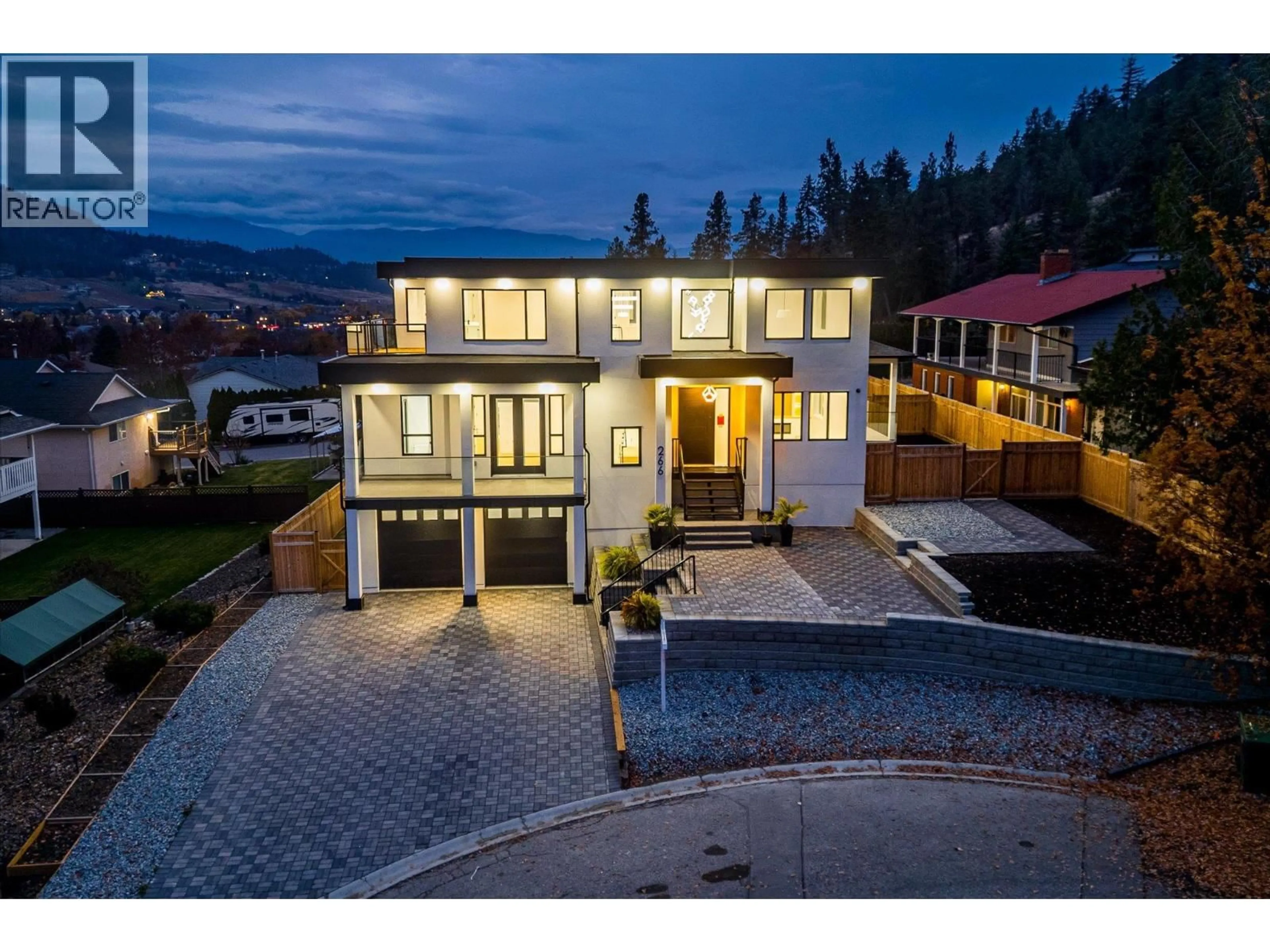 A pic from outside/outdoor area/front of a property/back of a property/a pic from drone, mountain view for 266 RANCHHILL COURT, Kelowna British Columbia V1V1T4