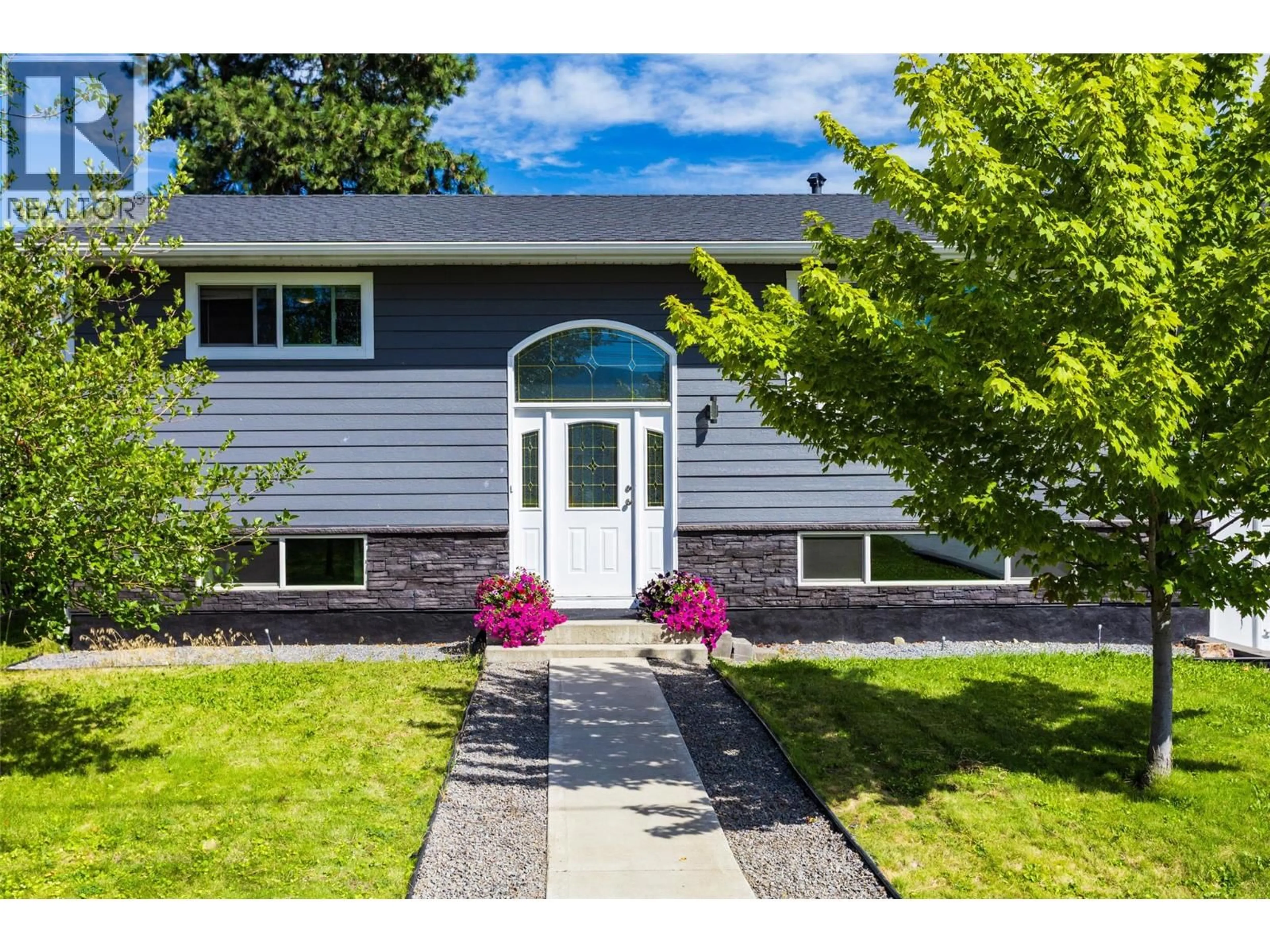 Home with vinyl exterior material, street for 320 HUSCH ROAD, Kelowna British Columbia V1X1N1