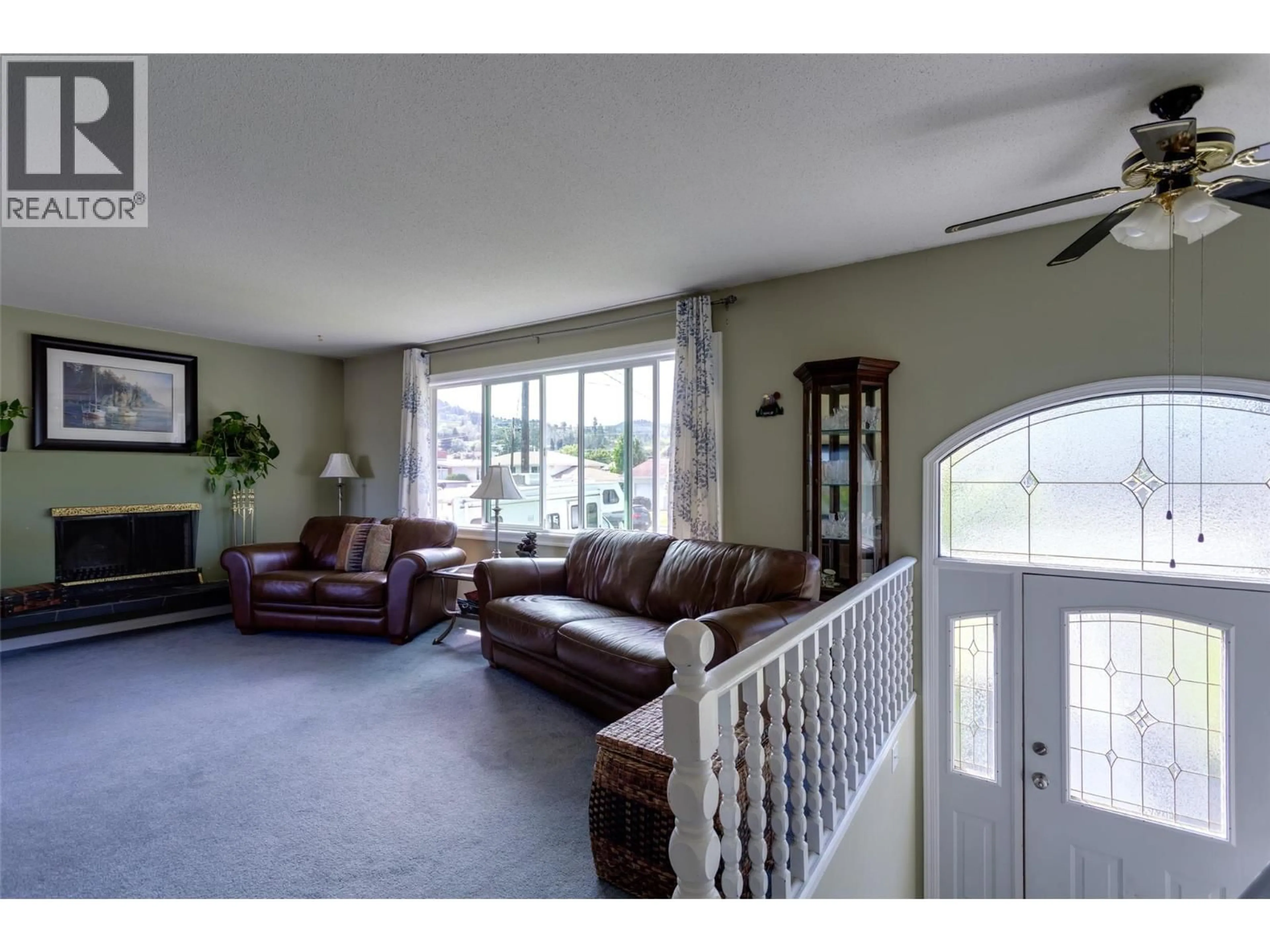 Living room with furniture, unknown for 320 HUSCH ROAD, Kelowna British Columbia V1X1N1