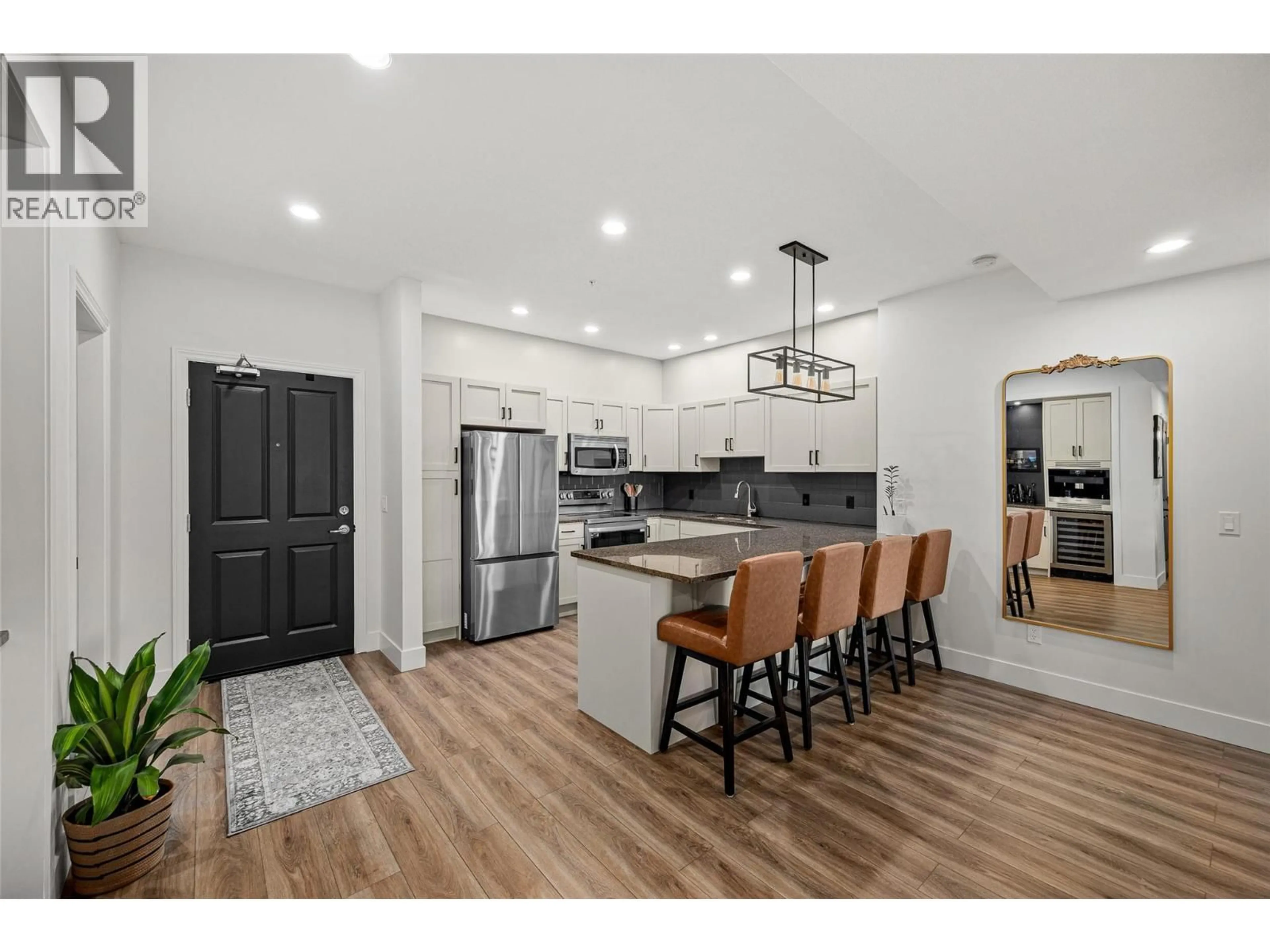 Open concept kitchen, wood/laminate floor for 2108 - 3843 BROWN ROAD, West Kelowna British Columbia V4T2J3