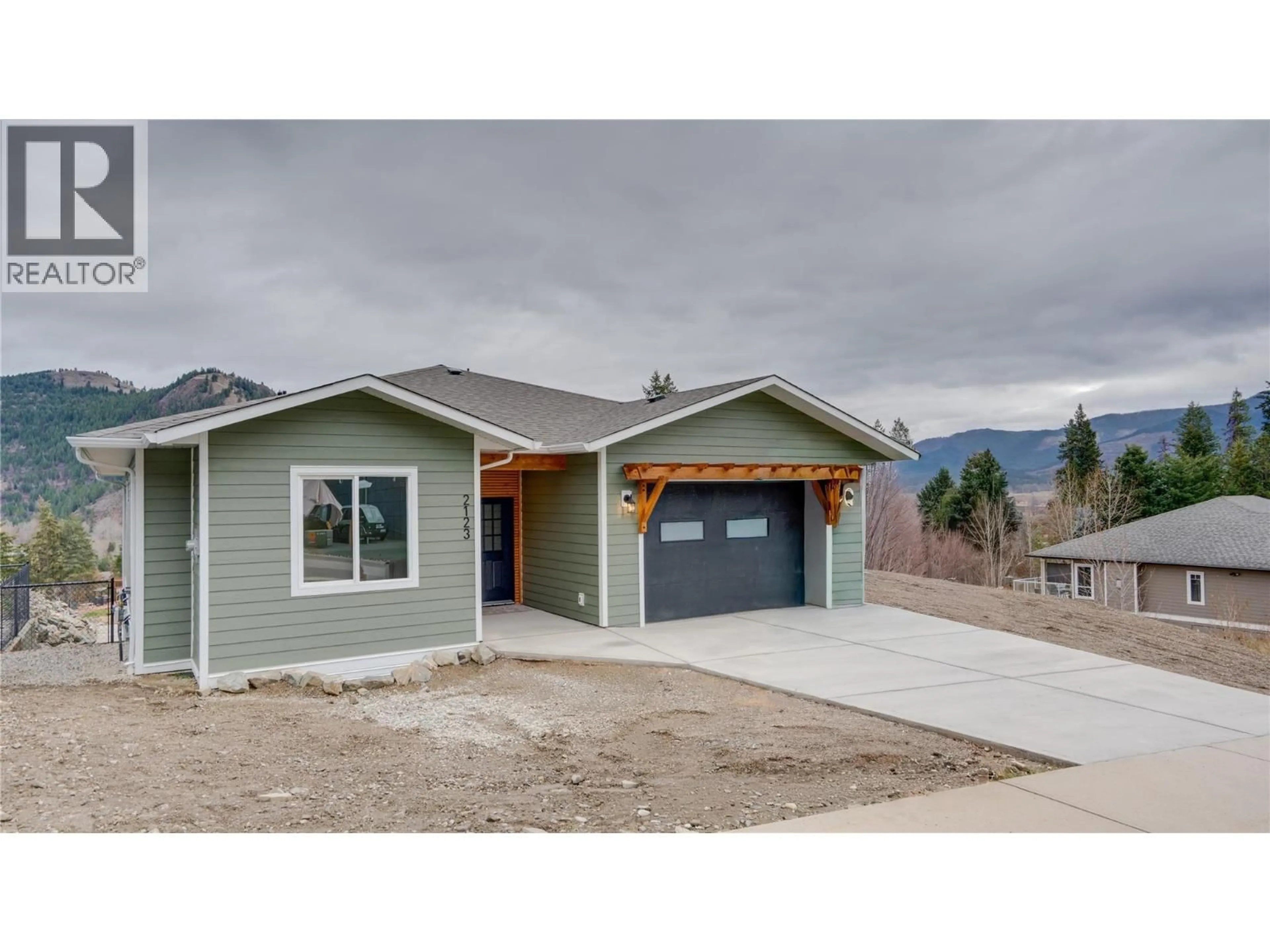 Home with vinyl exterior material, mountain view for 2123 MOUNTAIN VIEW AVENUE, Lumby British Columbia V0E2G0