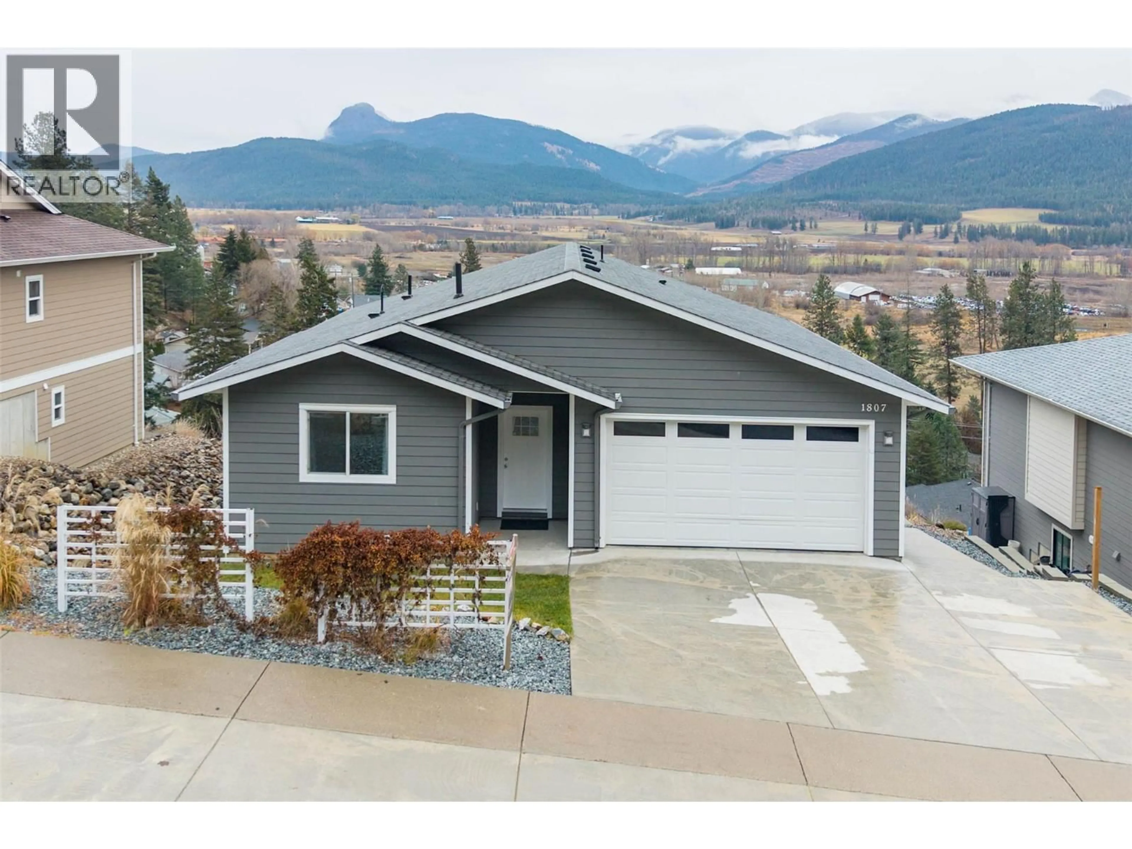 Home with vinyl exterior material, mountain view for 1807 GALLON AVENUE, Lumby British Columbia V0E2G0