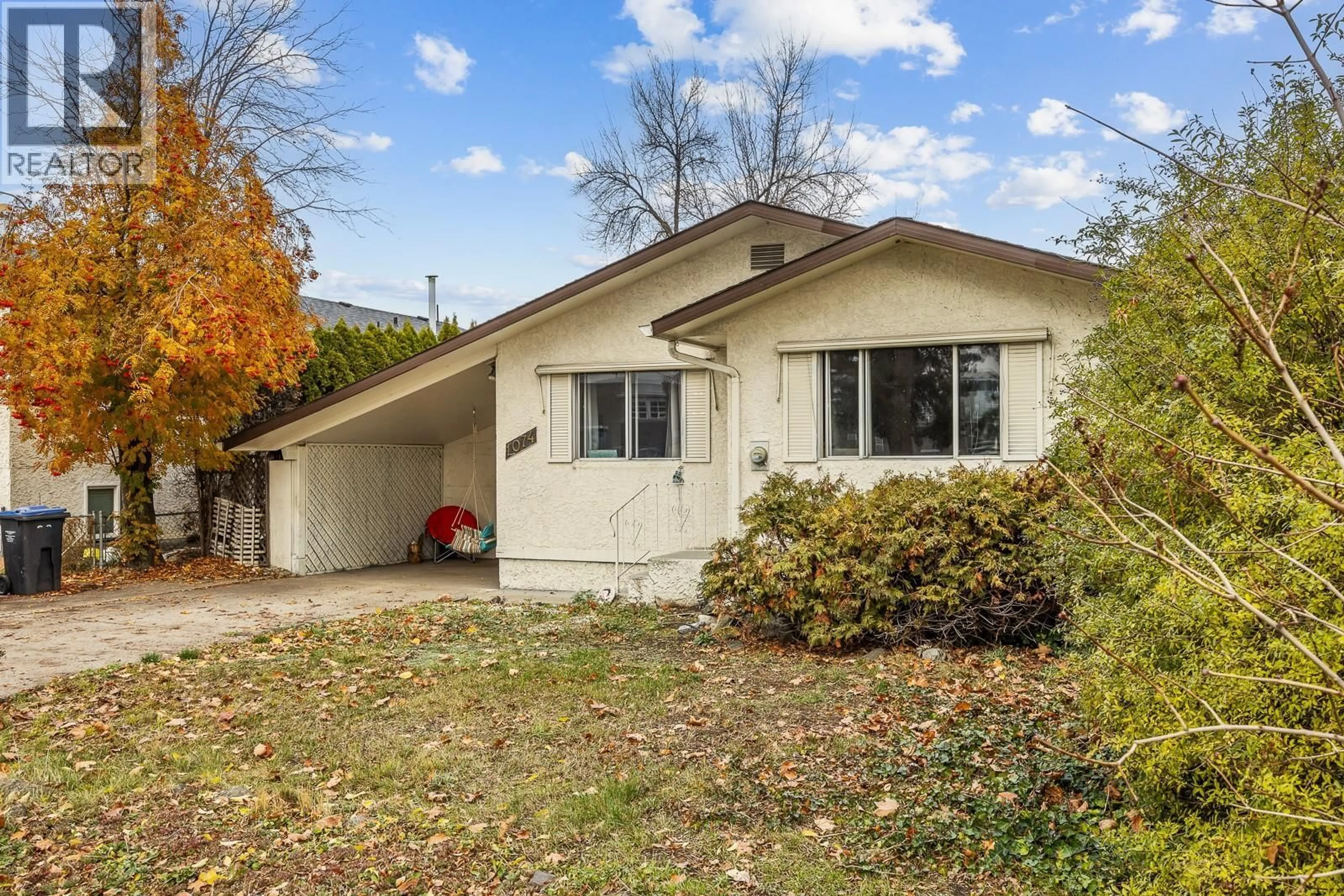 Home with vinyl exterior material, street for 1074 RAYMER AVENUE, Kelowna British Columbia V1Y4Z9