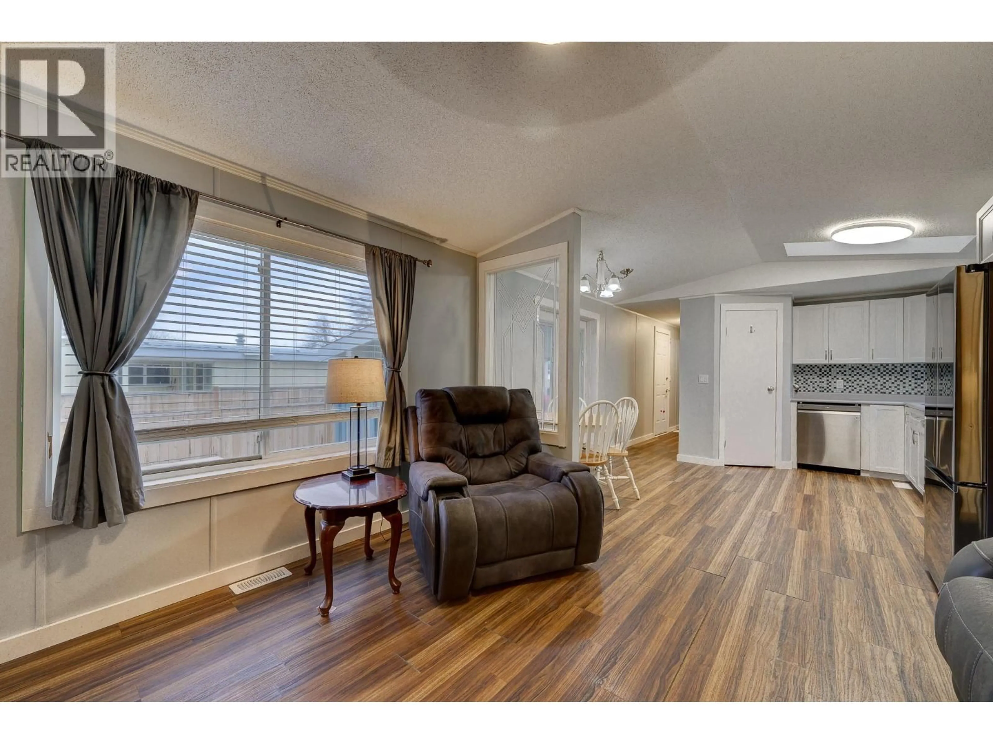 Living room with furniture, wood/laminate floor for E6 - 220 G & M ROAD, Kamloops British Columbia V2H1A4