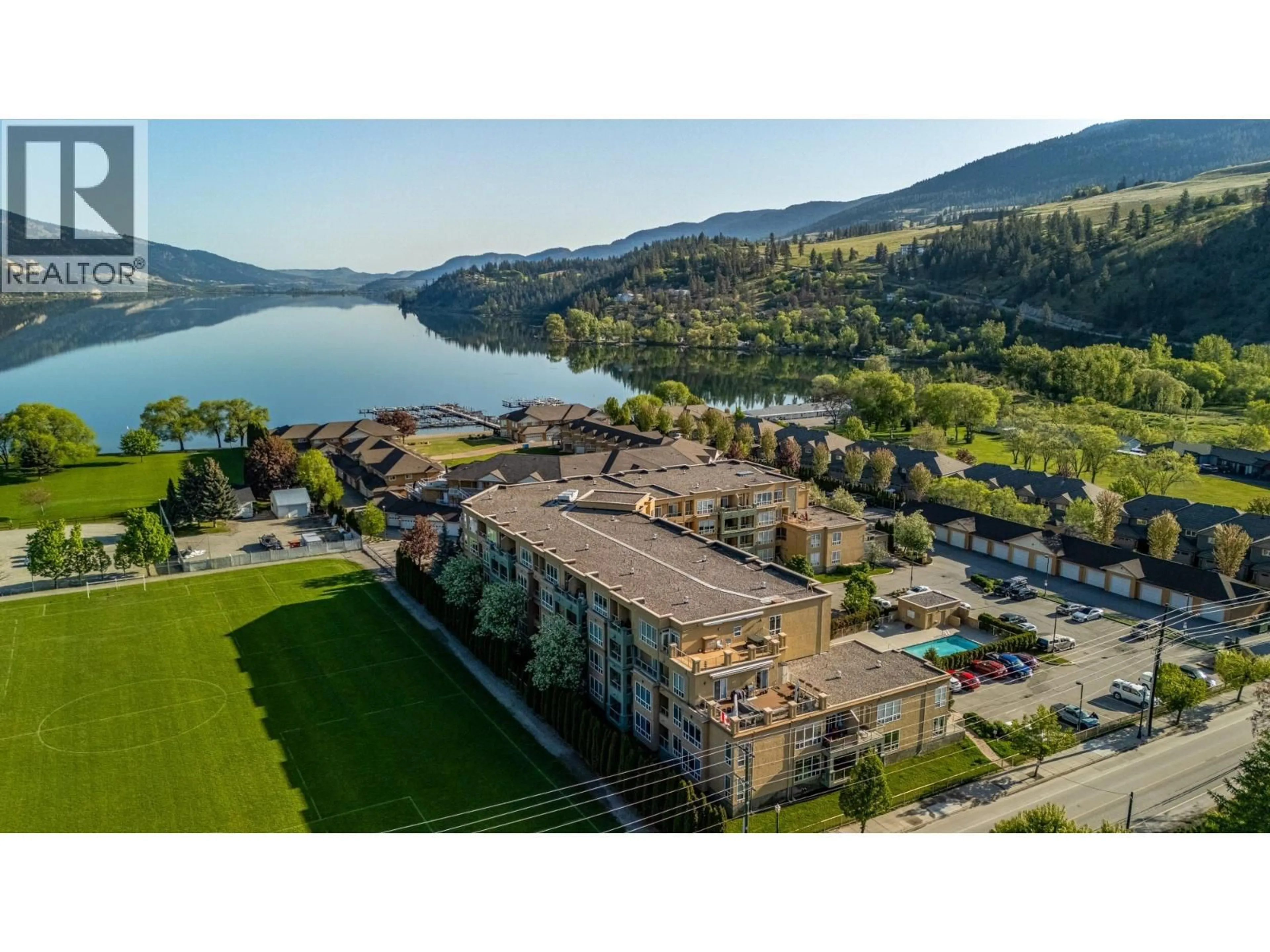 A pic from outside/outdoor area/front of a property/back of a property/a pic from drone, water/lake/river/ocean view for 414 - 3550 WOODSDALE ROAD, Lake Country British Columbia V4V2P5