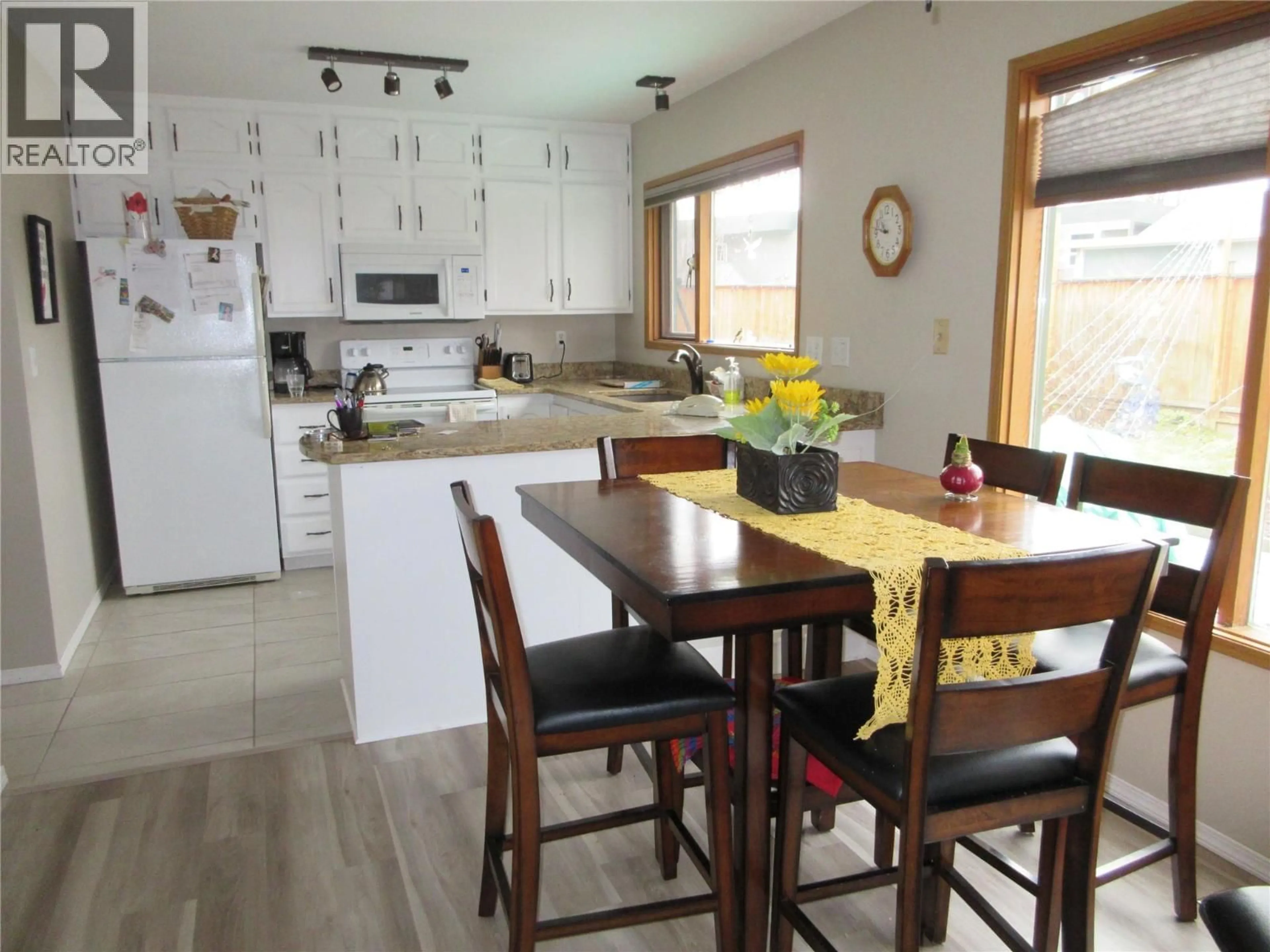 Open concept kitchen, wood/laminate floor for 3402 - 415 COMMONWEALTH ROAD, Kelowna British Columbia v4v2m4