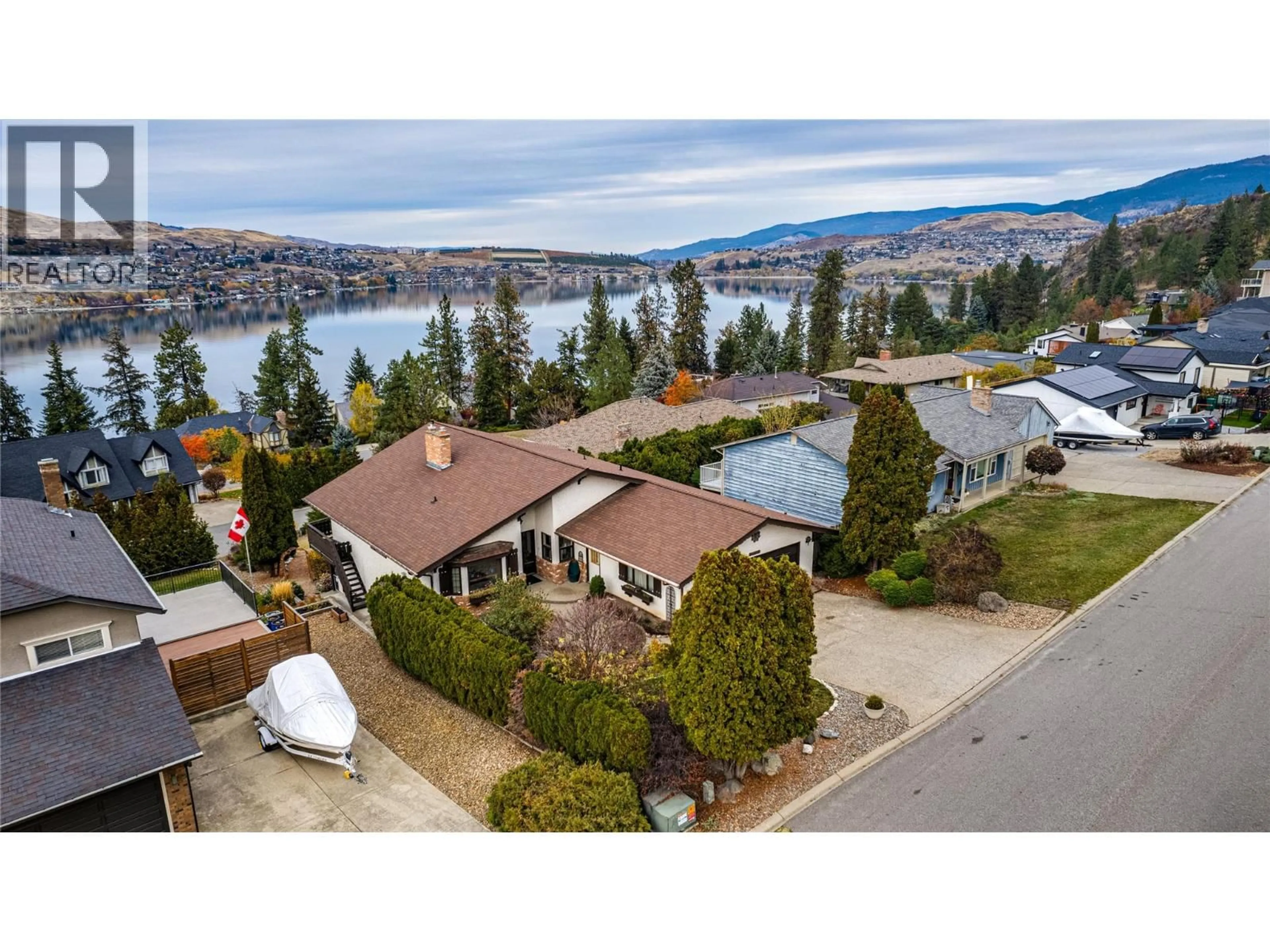 A pic from outside/outdoor area/front of a property/back of a property/a pic from drone, water/lake/river/ocean view for 14114 JUNIPER DRIVE, Coldstream British Columbia V1B2E5