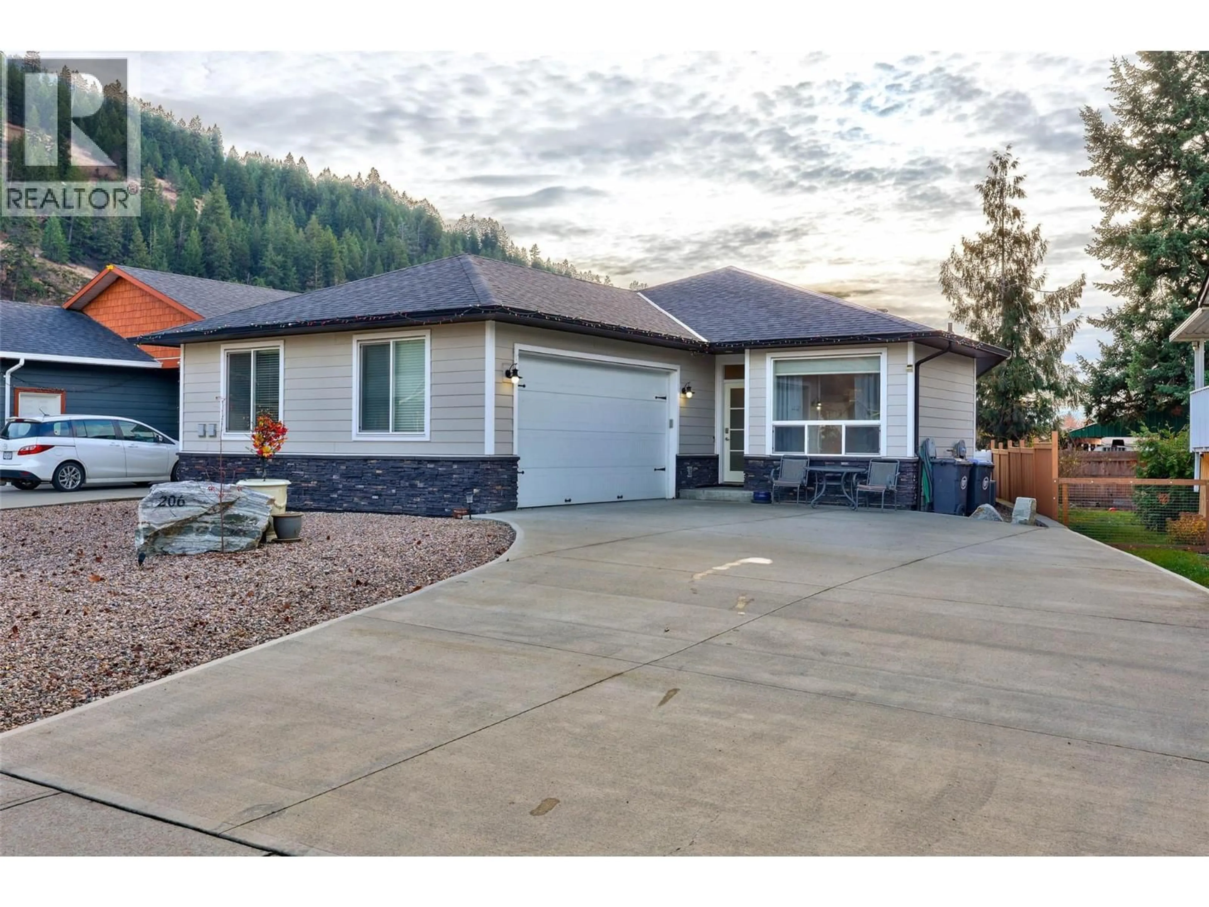 Home with vinyl exterior material, street for 206 ASH DRIVE, Chase British Columbia V0E1M0