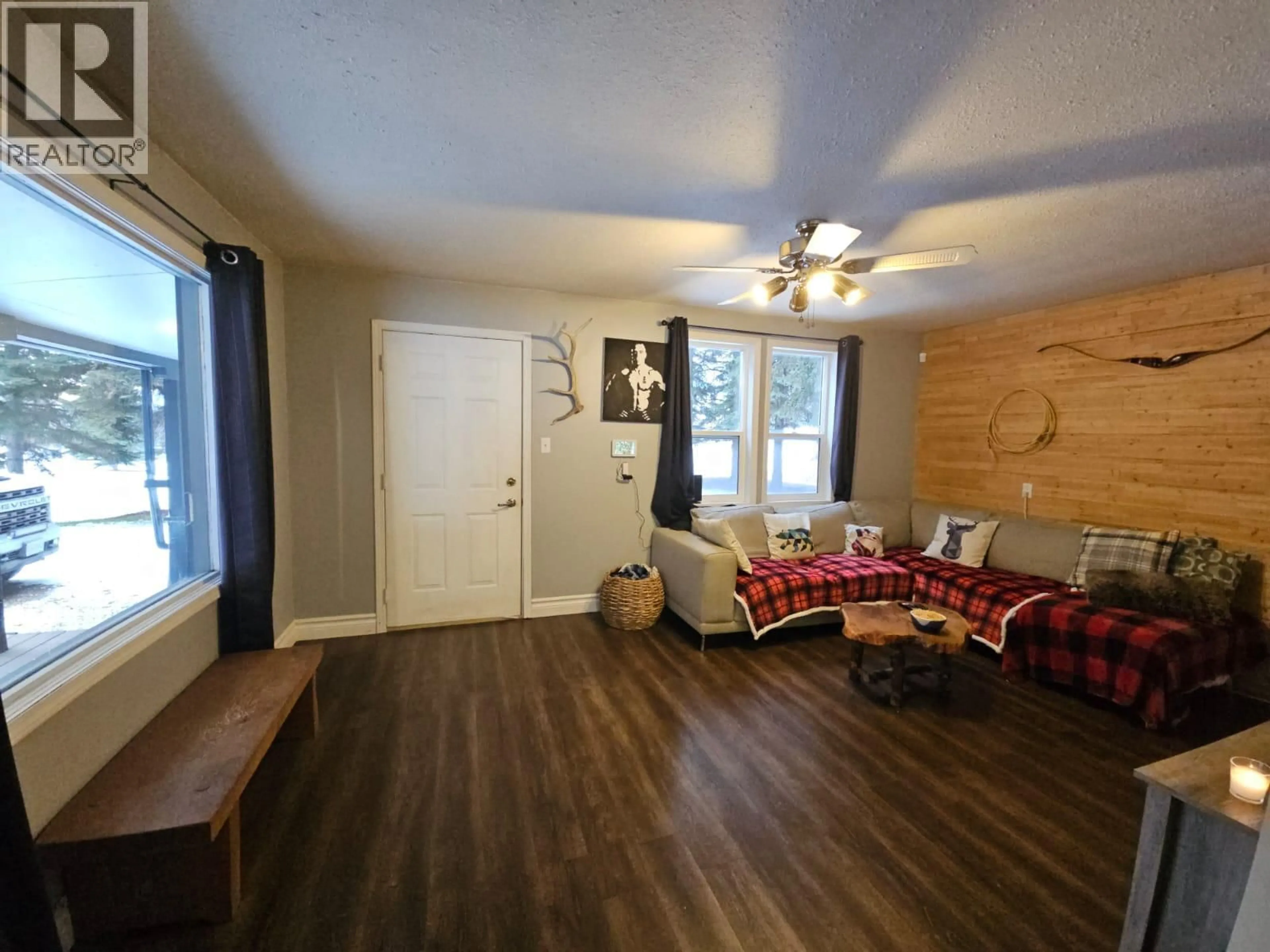 Living room with furniture, wood/laminate floor for 5640 WESTGATE ROAD NORTHWEST, Chetwynd British Columbia V0C1J0