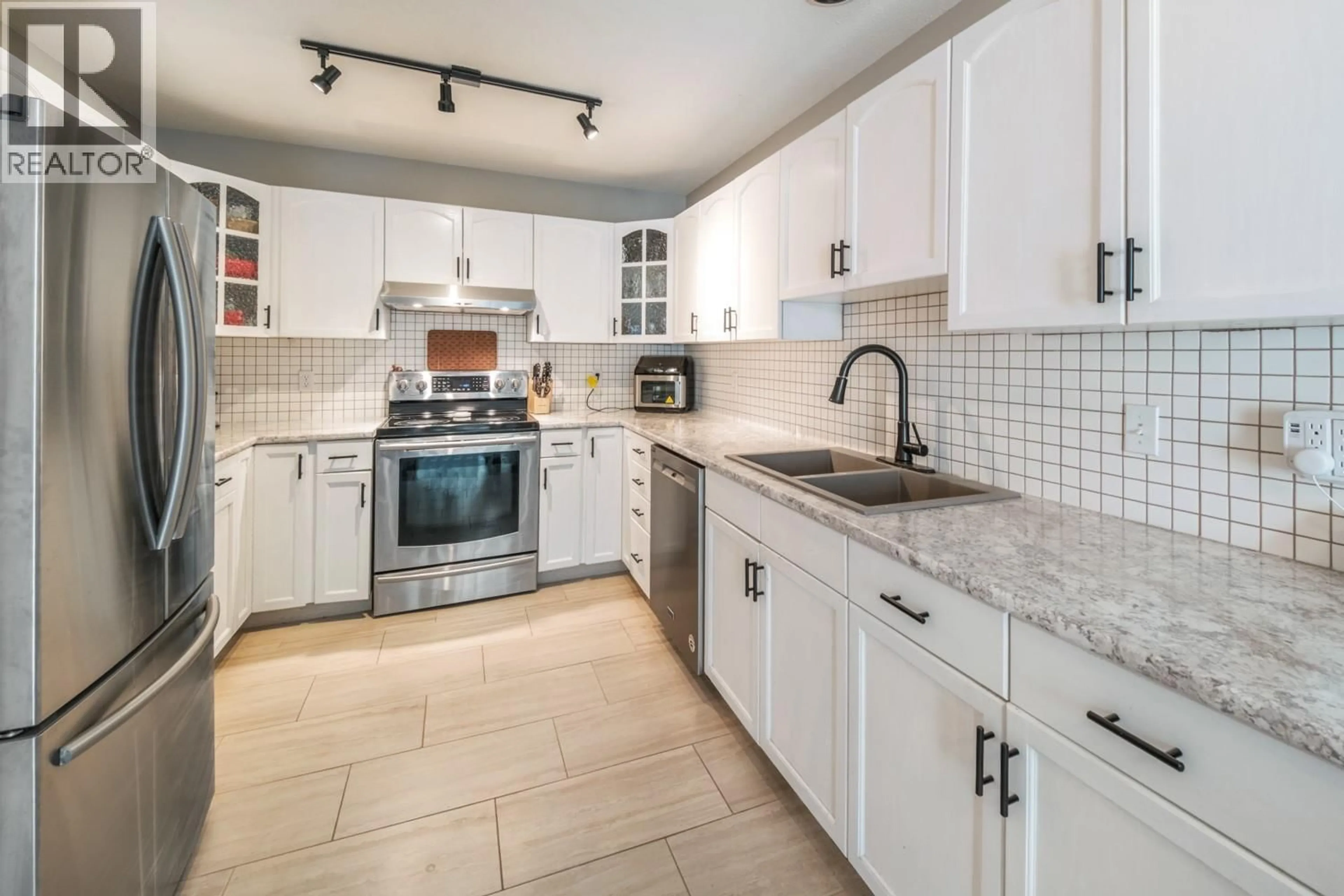 Open concept kitchen, ceramic/tile floor for 16 - 1801 53 AVENUE, Vernon British Columbia V1T4E7