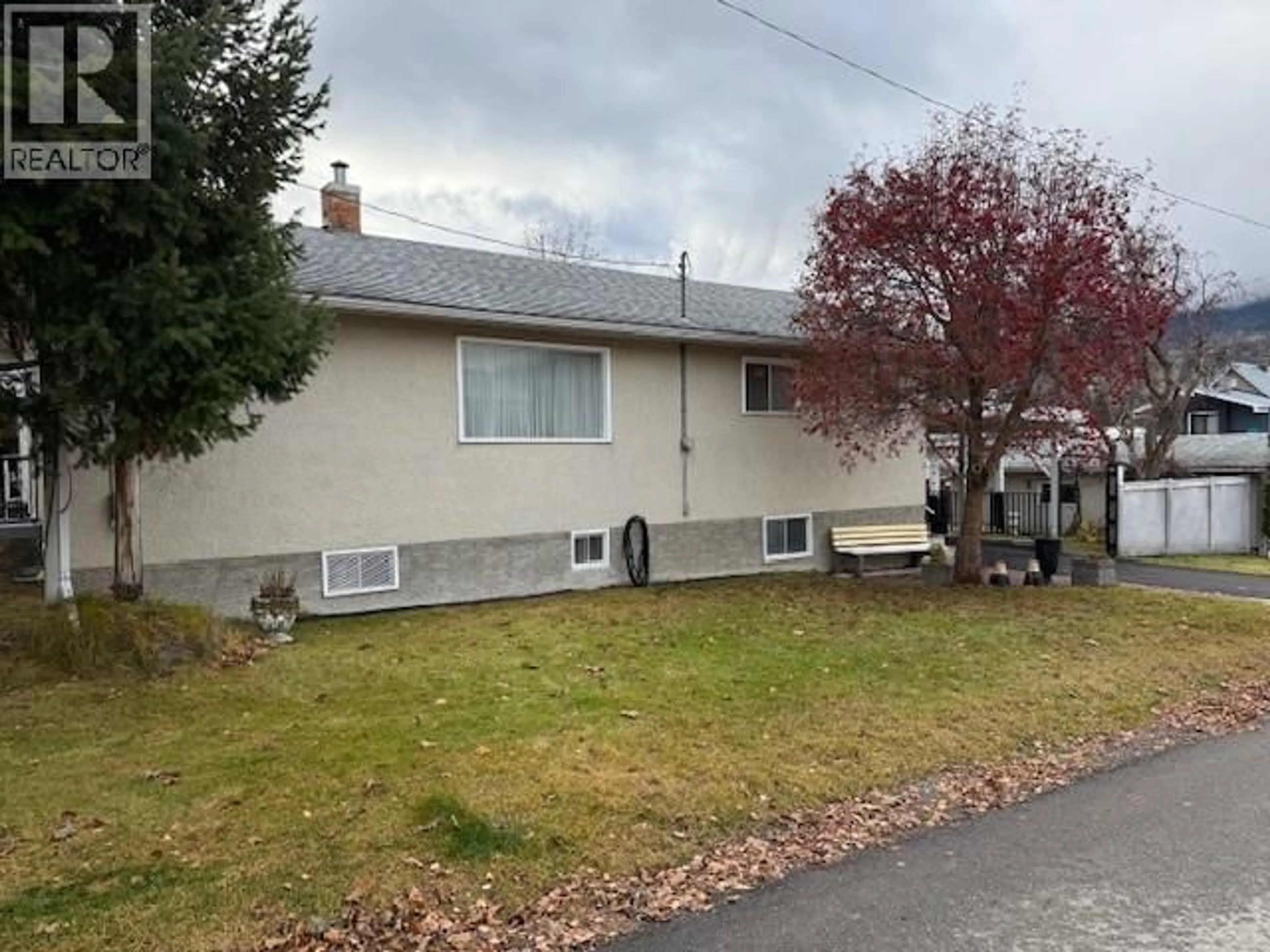 Home with vinyl exterior material, street for 1091 3RD AVENUE, Fernie British Columbia V0B1M0