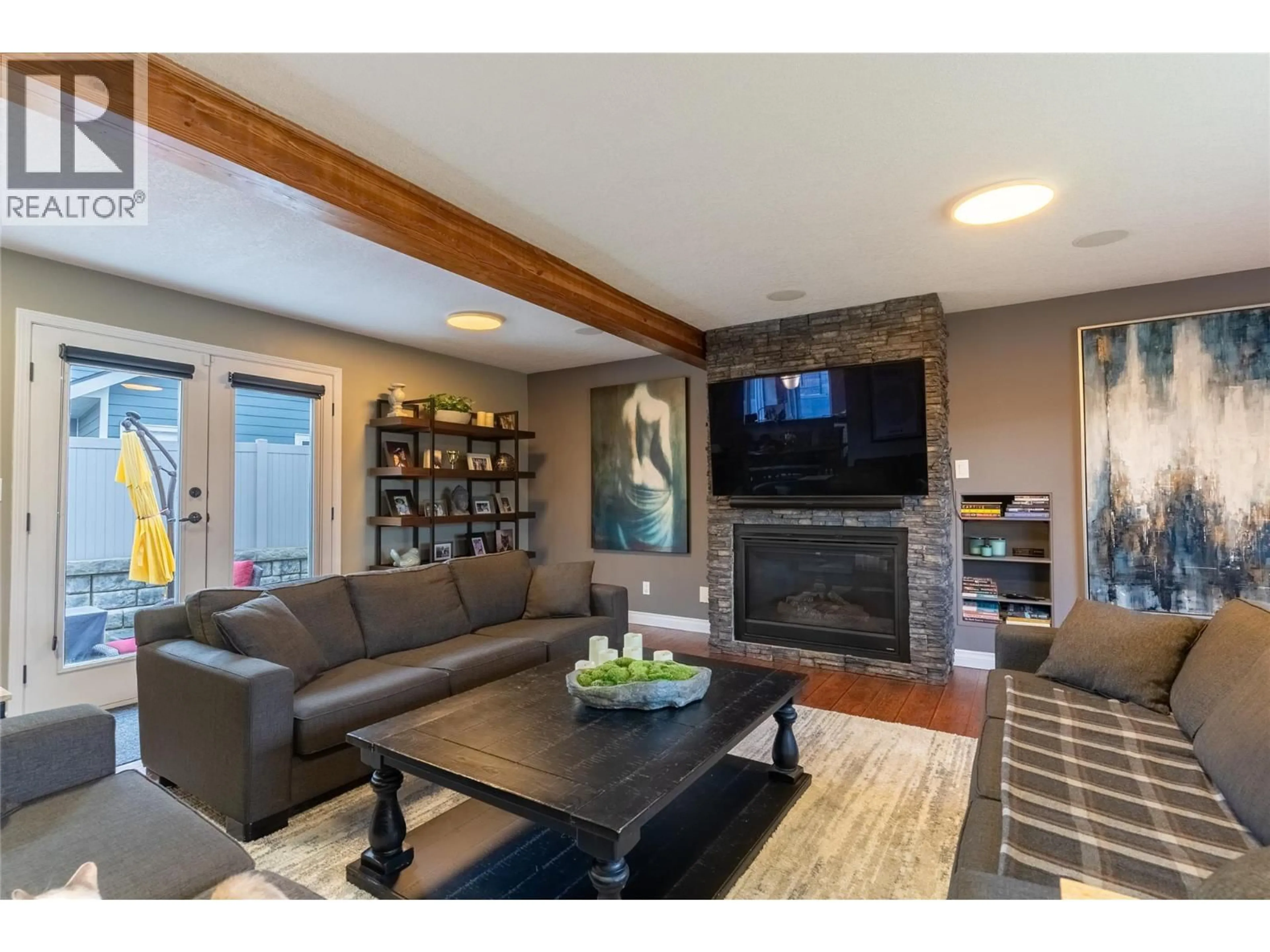 Living room with furniture, wood/laminate floor for 1915 GLEN GARY DRIVE, Kamloops British Columbia V2E1P5