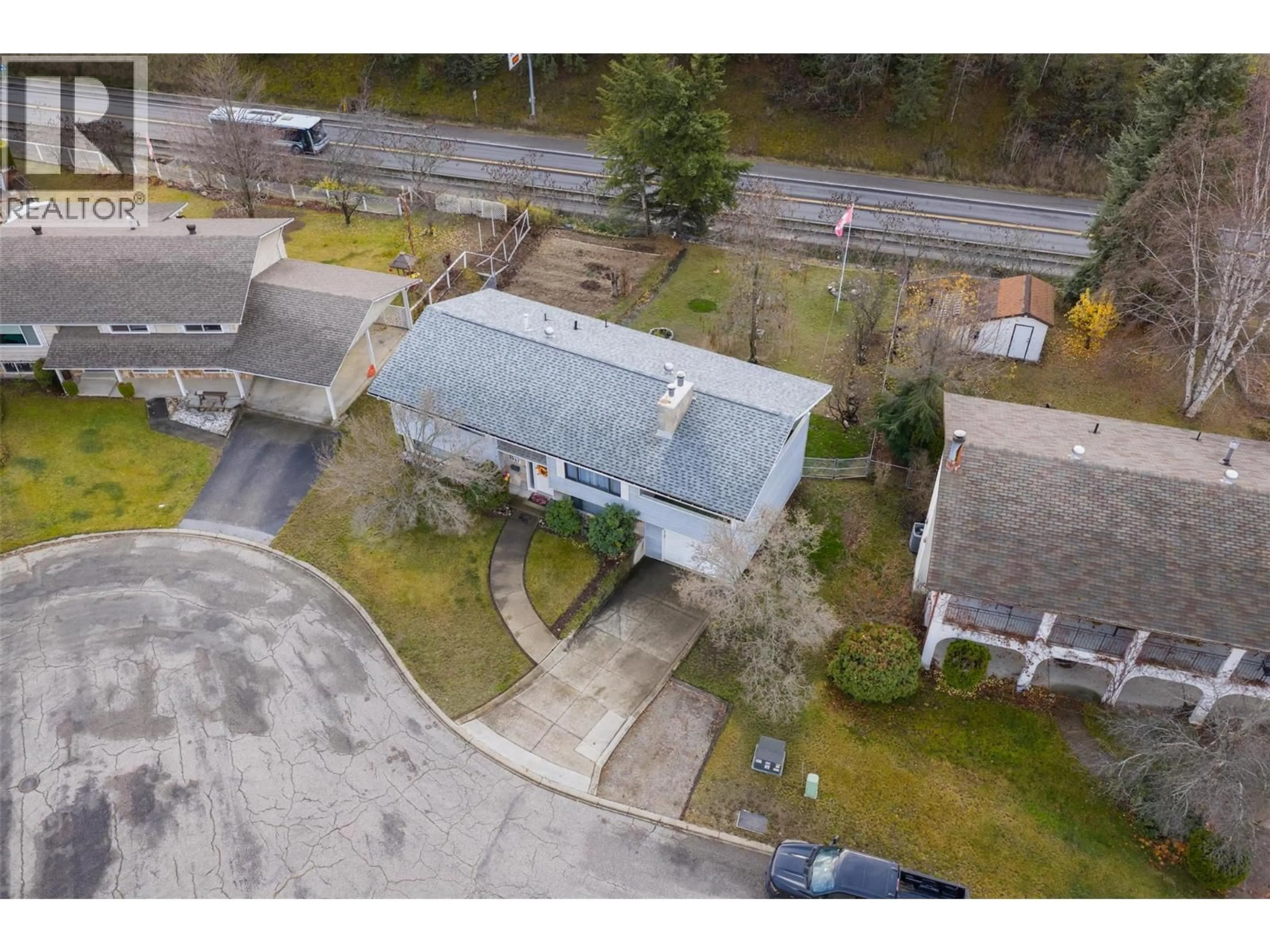 A pic from outside/outdoor area/front of a property/back of a property/a pic from drone, street for 1937 RIVERSIDE CRESCENT, Castlegar British Columbia V1N3W5