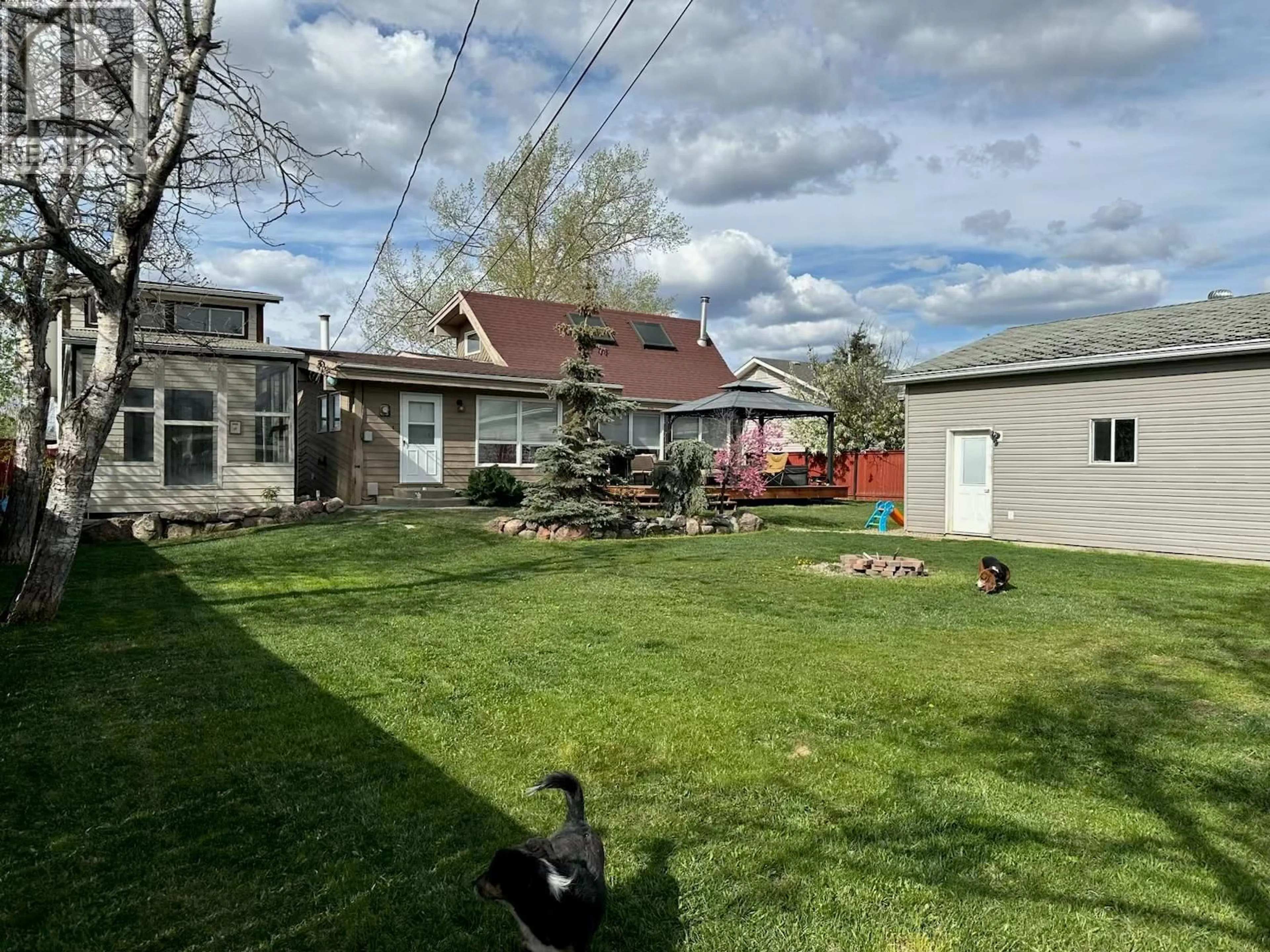 A pic from outside/outdoor area/front of a property/back of a property/a pic from drone, street for 1605 108 AVENUE, Dawson Creek British Columbia V1G2T5