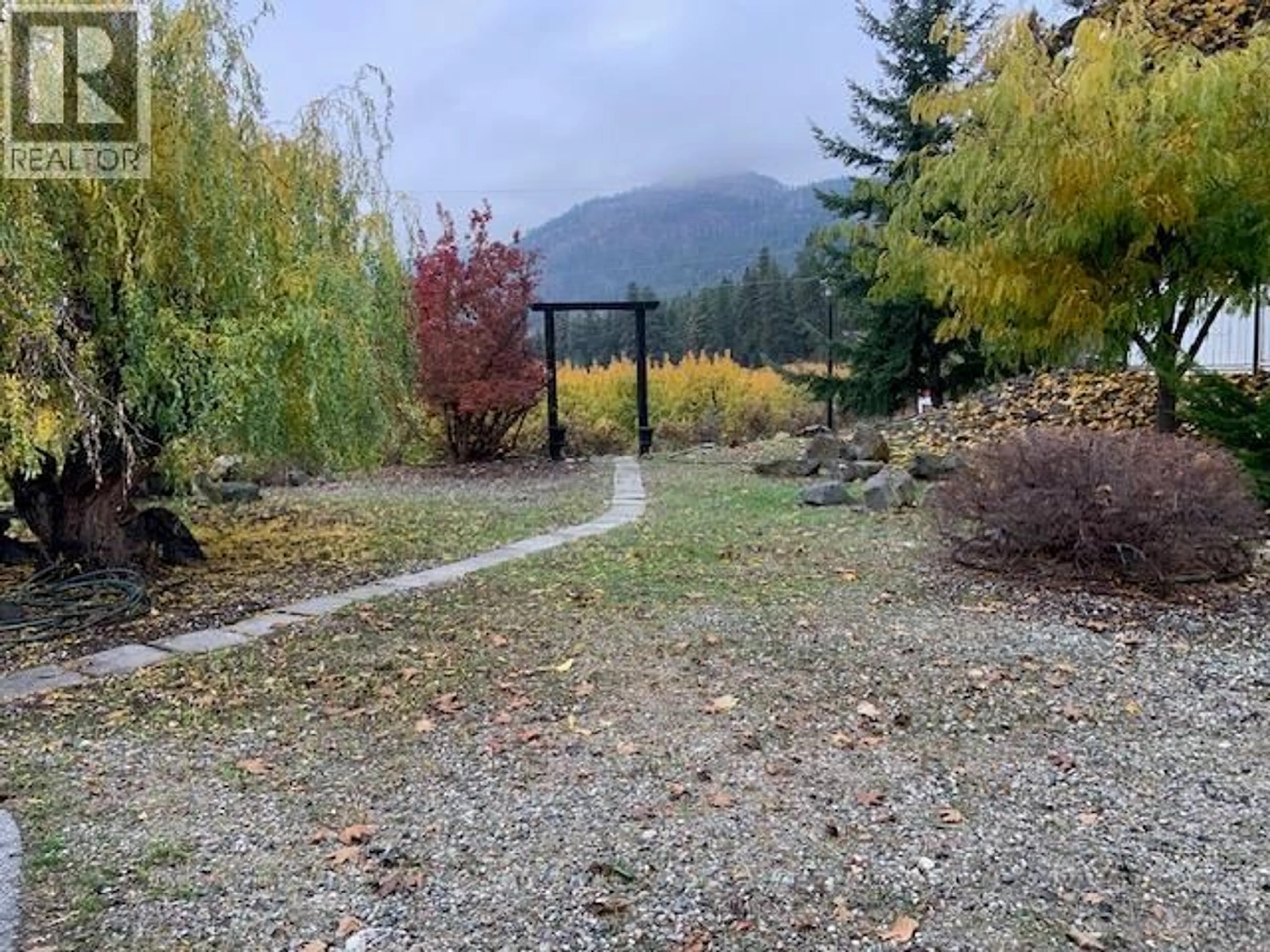 A pic from outside/outdoor area/front of a property/back of a property/a pic from drone, mountain view for 5037 ELLIOTT AVENUE, Peachland British Columbia V0H1X8