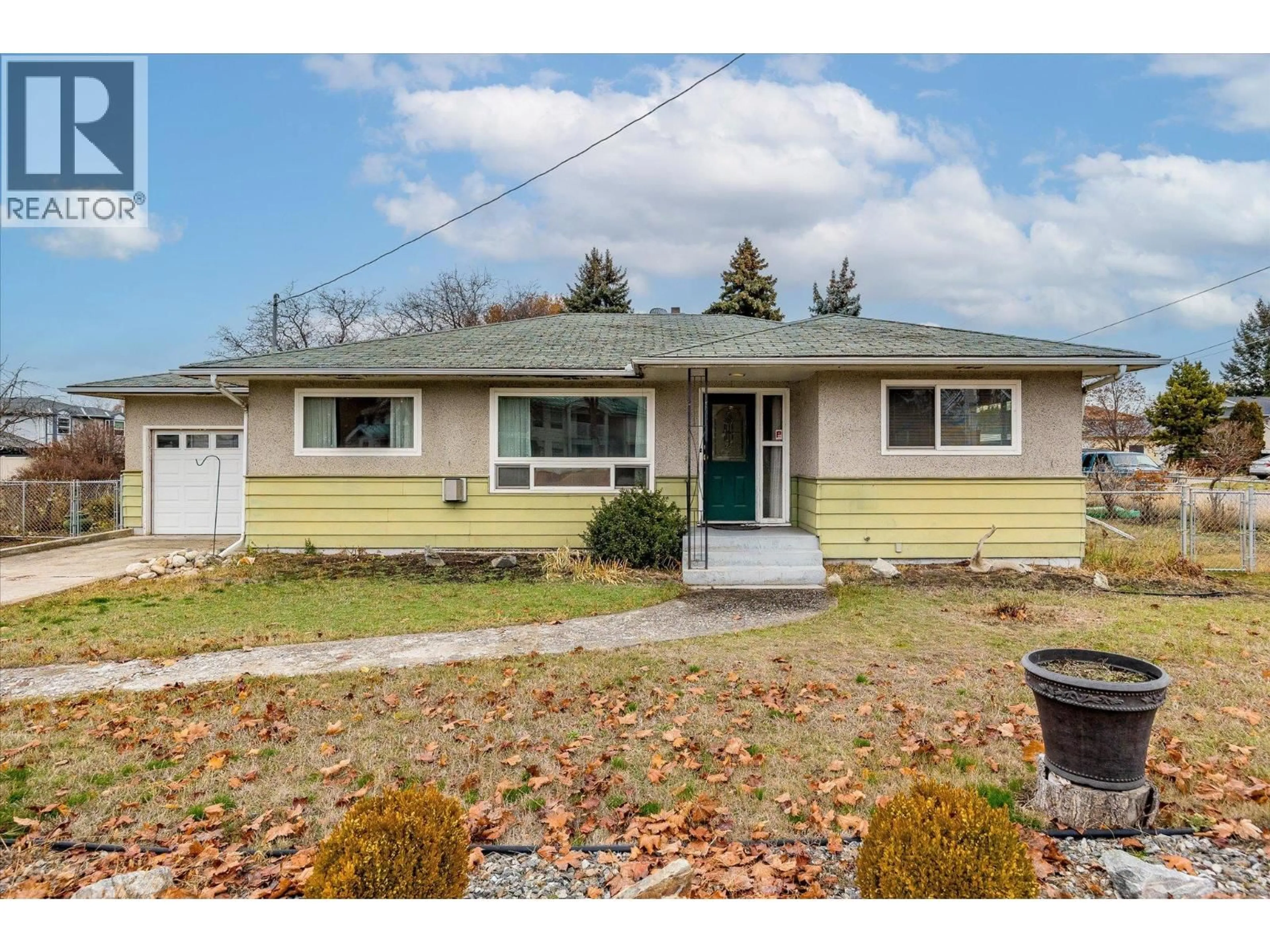 Home with vinyl exterior material, street for 1190 GUISACHAN ROAD, Kelowna British Columbia V1Y7X4