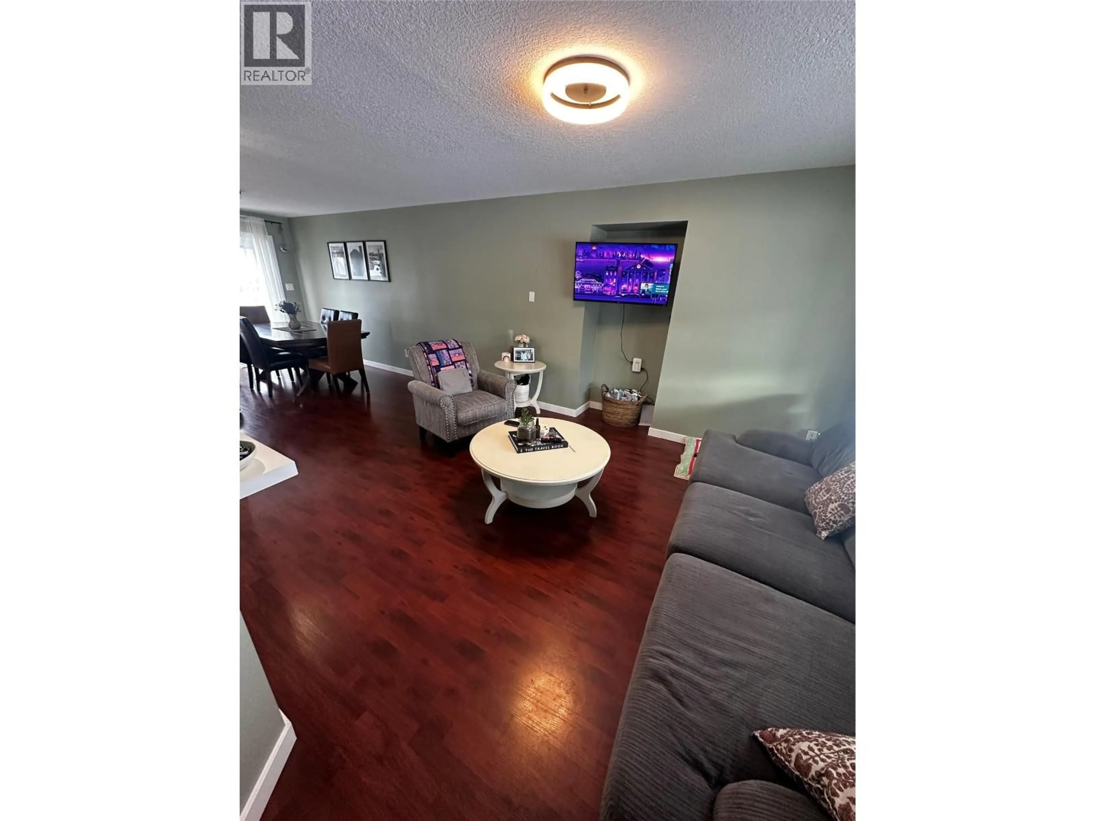 Living room with furniture, wood/laminate floor for 5213 40 ST NE STREET, Chetwynd British Columbia V0C1J0