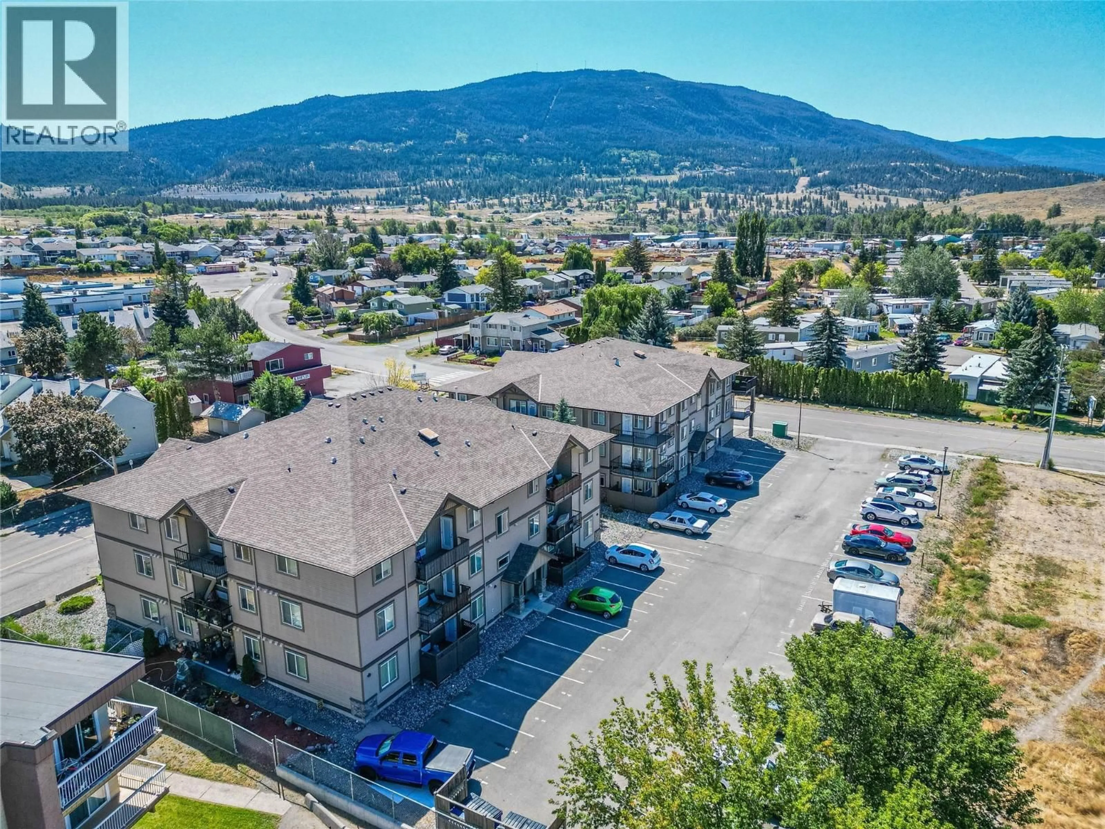 A pic from outside/outdoor area/front of a property/back of a property/a pic from drone, mountain view for 304 - 1701 MENZIES STREET, Merritt British Columbia V1K1A5