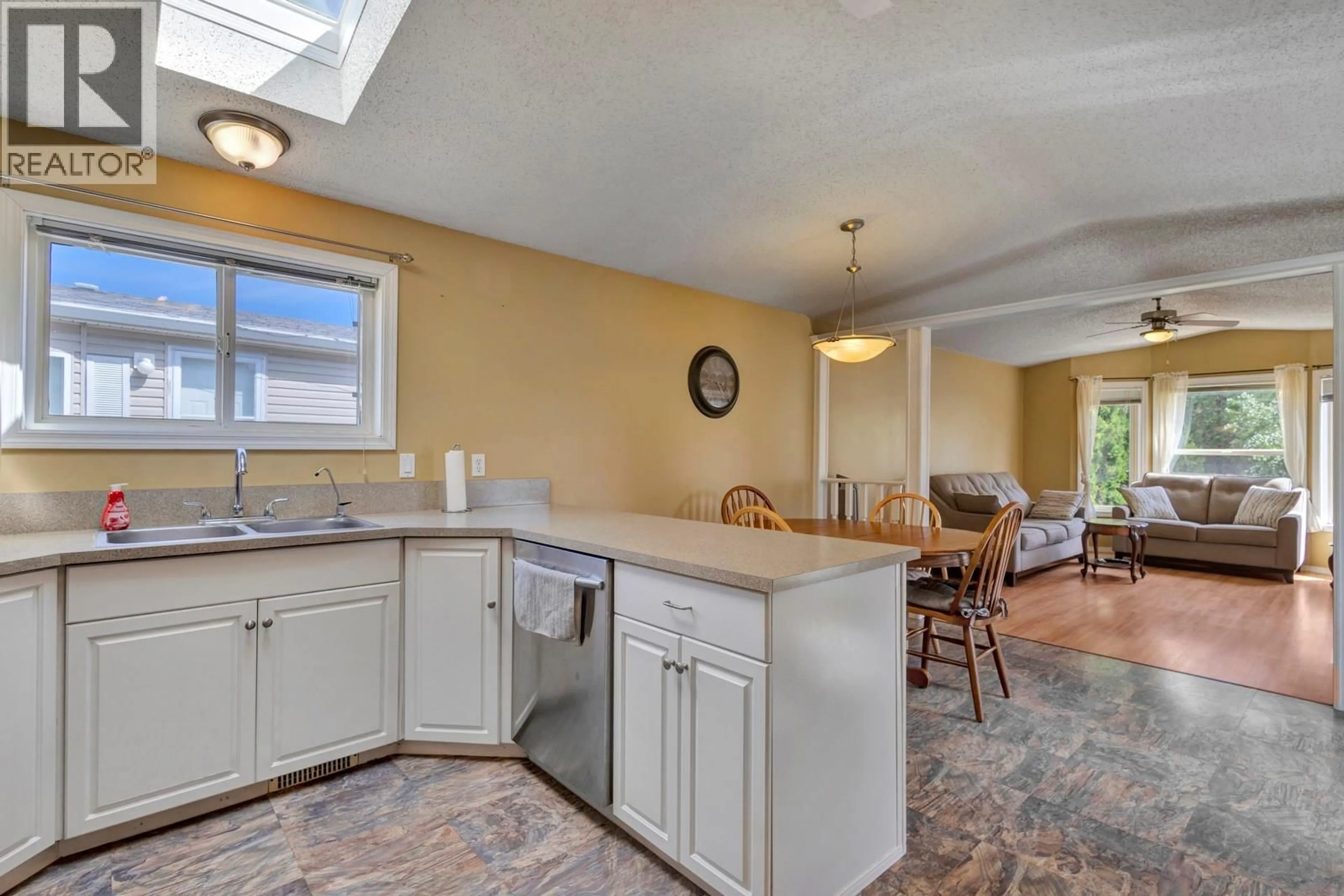 Open concept kitchen, ceramic/tile floor for 53 - 9510 HWY 97 N HIGHWAY, Vernon British Columbia V1H1R8