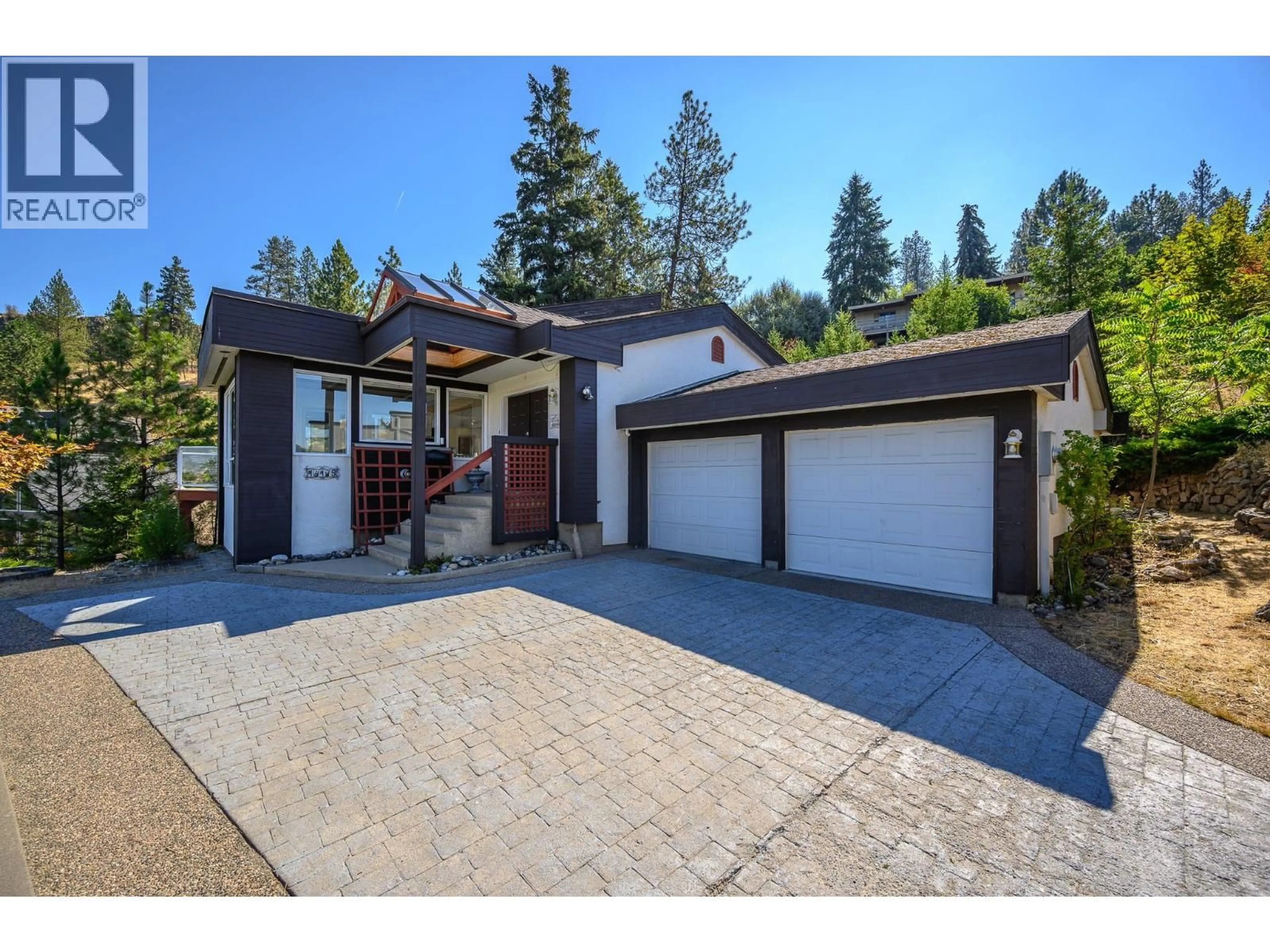 Home with brick exterior material, street for 14175 TAMARACK DRIVE, Coldstream British Columbia V1B2E1