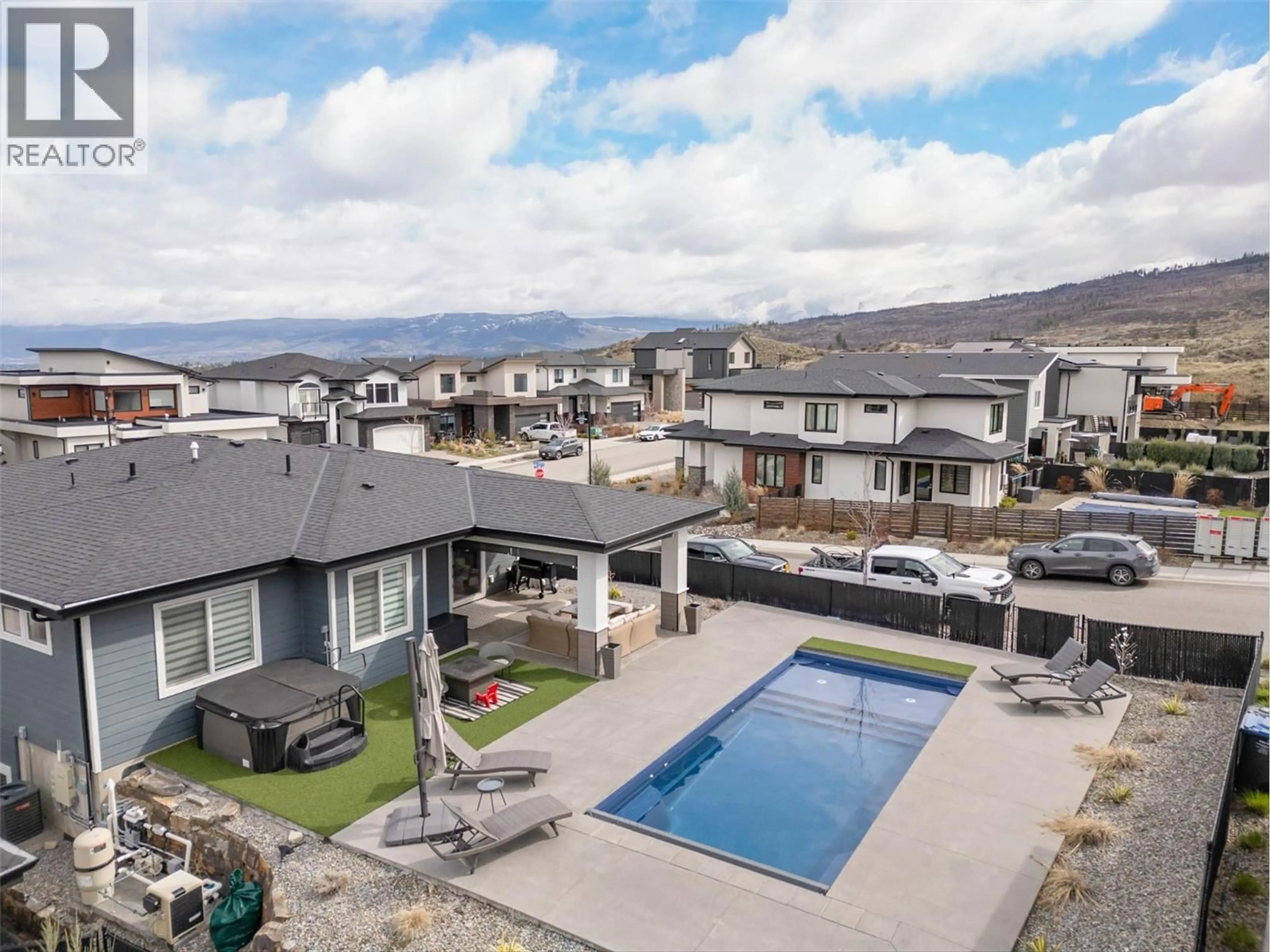 A pic from outside/outdoor area/front of a property/back of a property/a pic from drone, mountain view for 1235 PONDS AVENUE, Kelowna British Columbia V1W5N1
