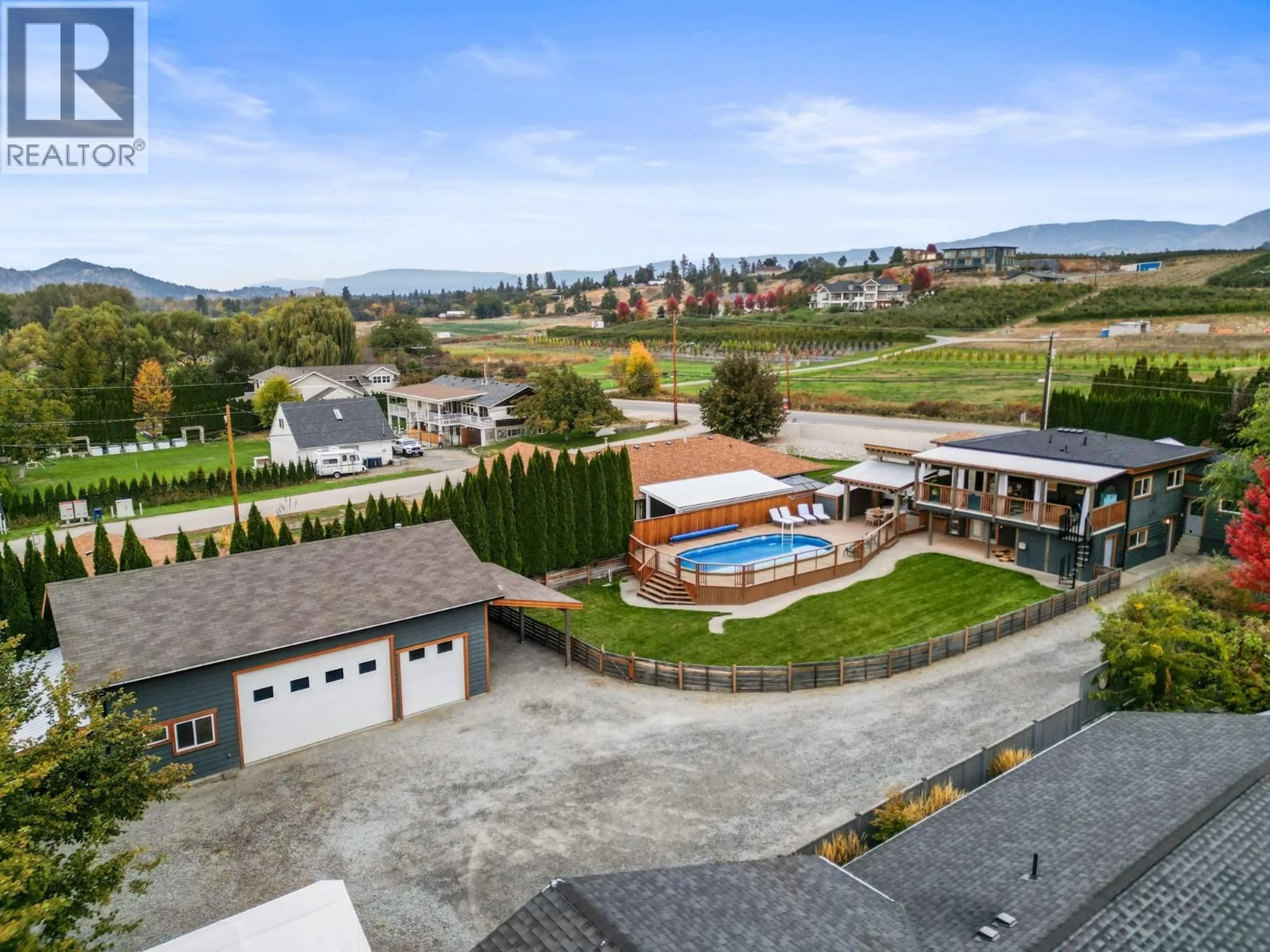 A pic from outside/outdoor area/front of a property/back of a property/a pic from drone, mountain view for 3588 SPIERS ROAD, Kelowna British Columbia V1W4A8