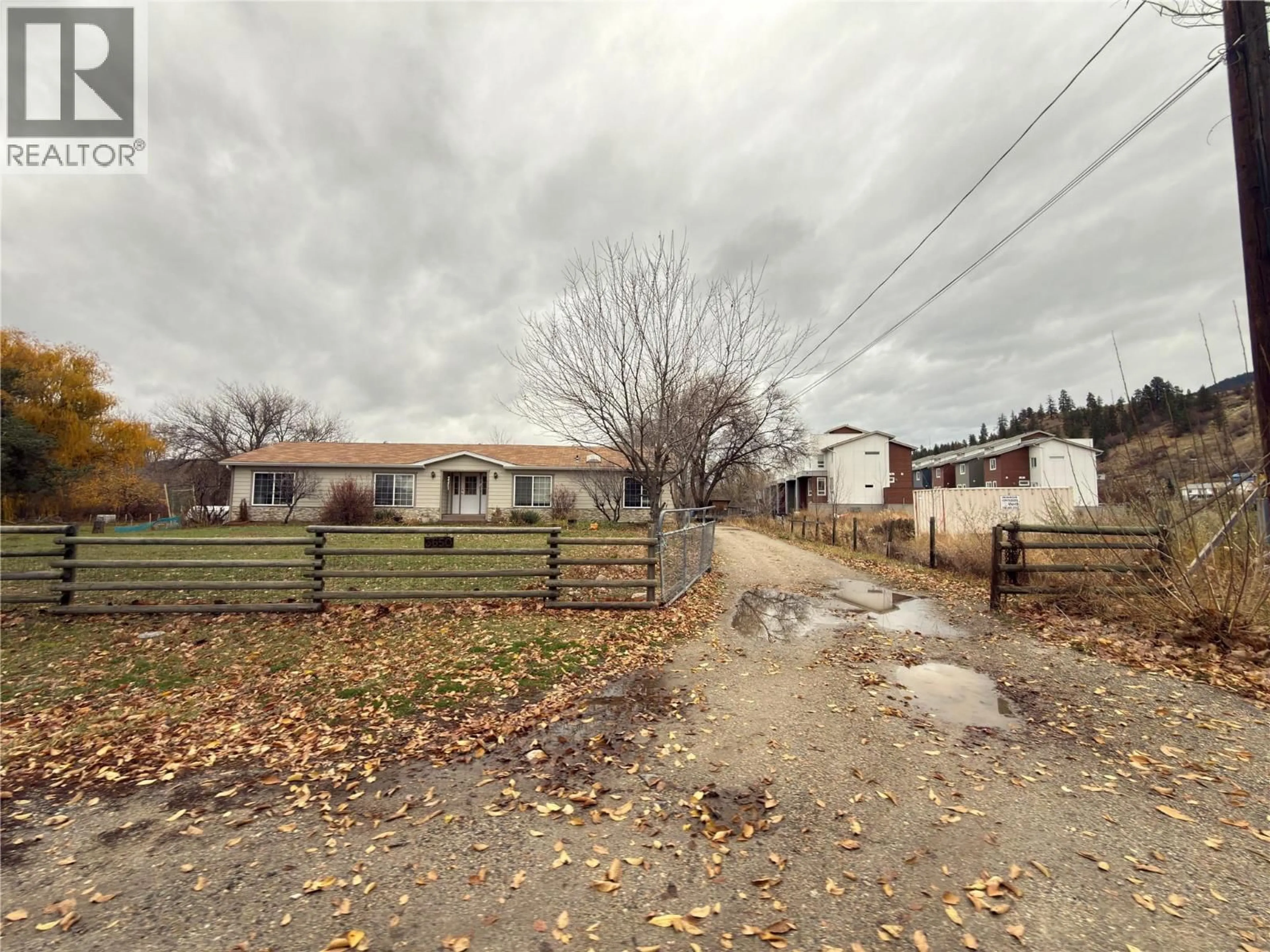 A pic from outside/outdoor area/front of a property/back of a property/a pic from drone, street for 3650 REDECOPP ROAD, Lake Country British Columbia v4v1x5