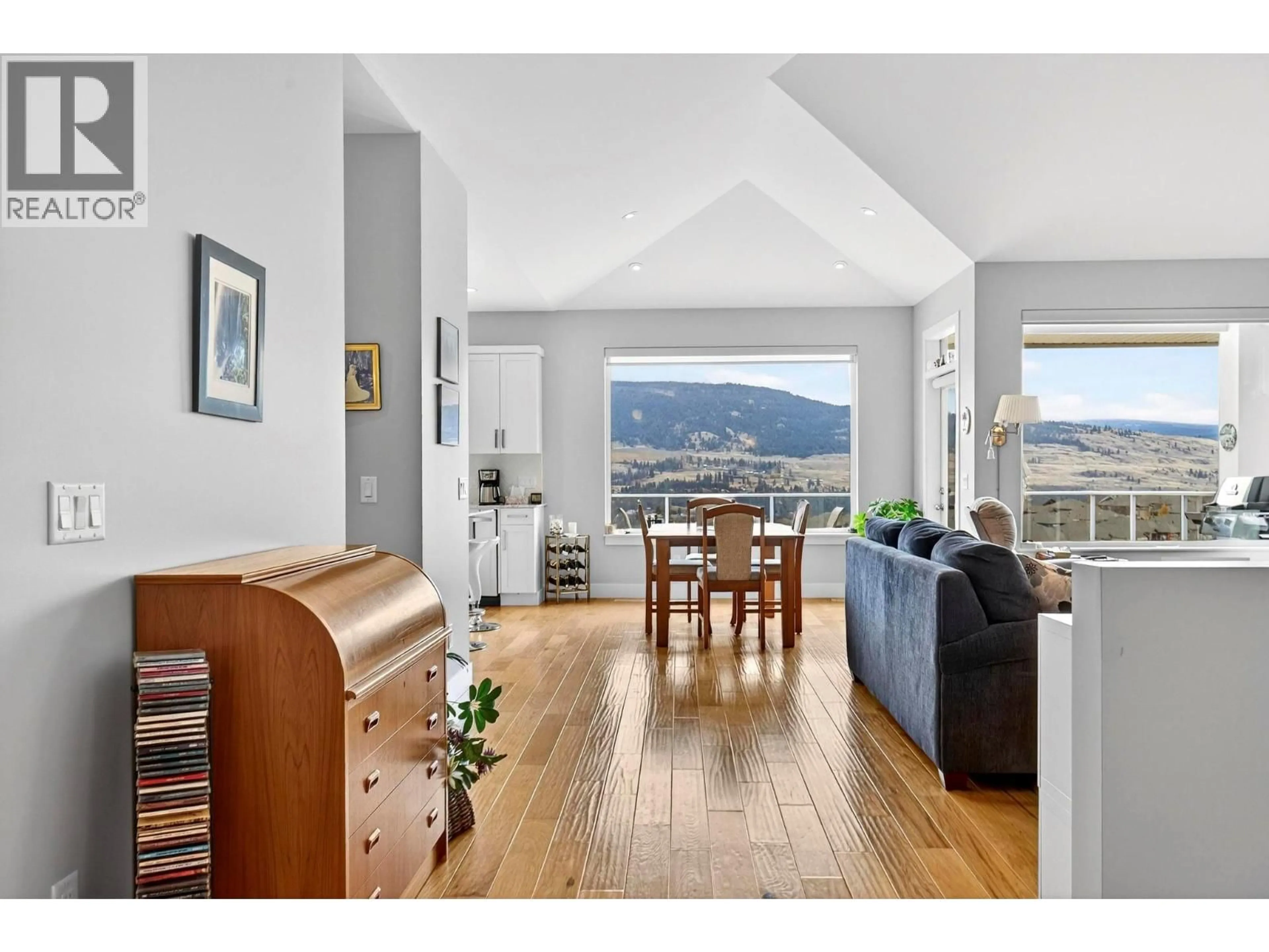 Living room with furniture, wood/laminate floor for 13246 LAKE HILL DRIVE, Lake Country British Columbia V4V2R2