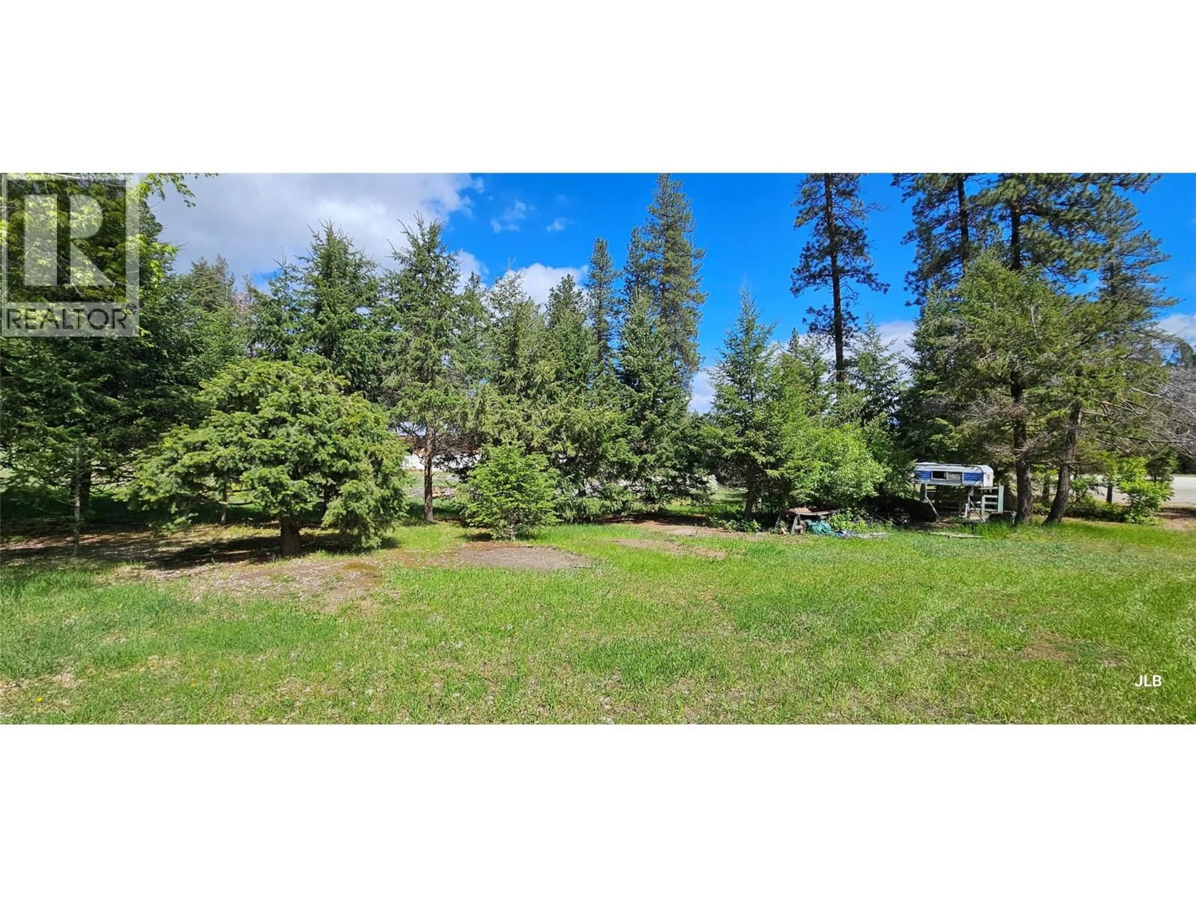 A pic from outside/outdoor area/front of a property/back of a property/a pic from drone, forest/trees view for 4180 HIGHWAY 3 OTHER, Rock Creek British Columbia V0H1Y0