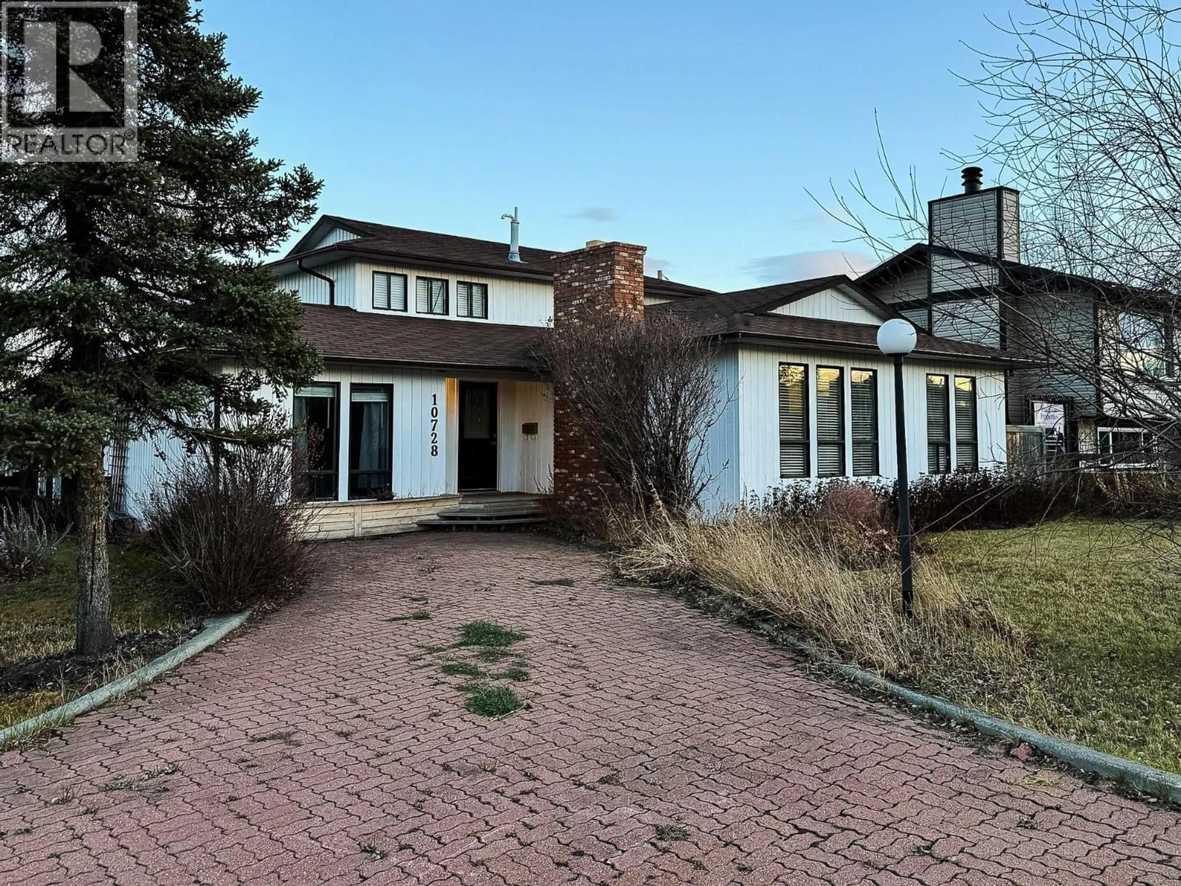 Home with brick exterior material, street for 10728 18 STREET, Dawson Creek British Columbia V1G4E2