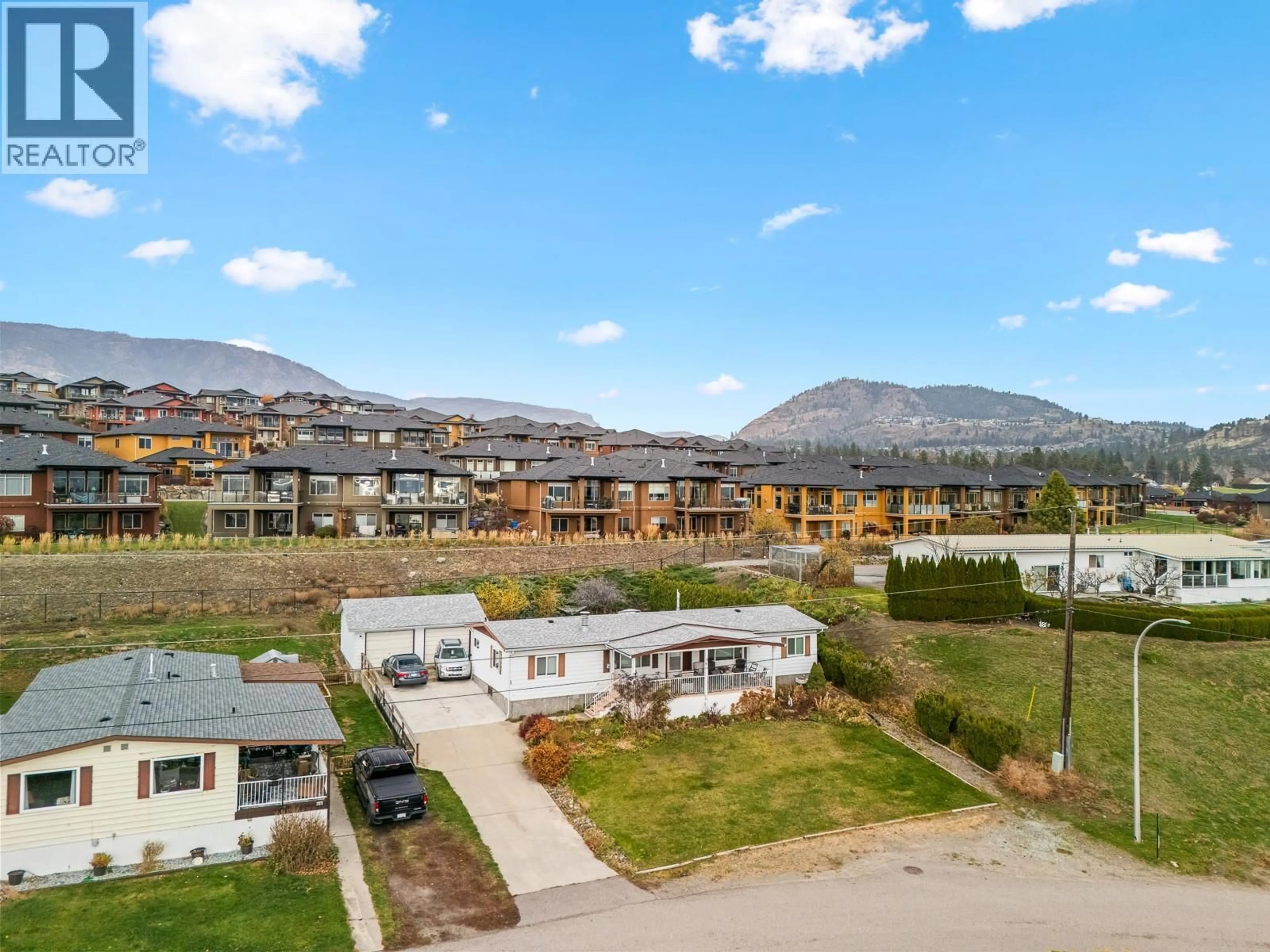 A pic from outside/outdoor area/front of a property/back of a property/a pic from drone, mountain view for 66 - 2098 BOUCHERIE ROAD, West Kelowna British Columbia V4T2A5