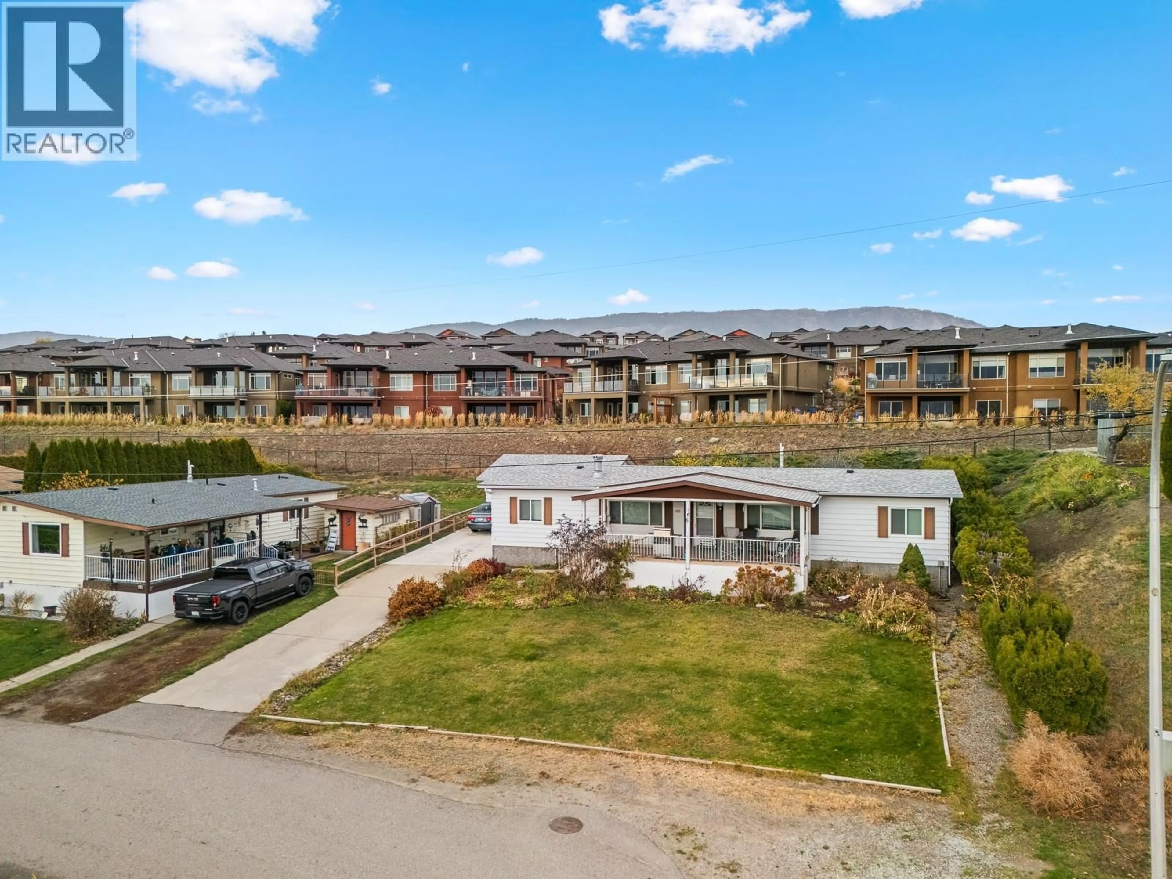 A pic from outside/outdoor area/front of a property/back of a property/a pic from drone, mountain view for 66 - 2098 BOUCHERIE ROAD, West Kelowna British Columbia V4T2A5