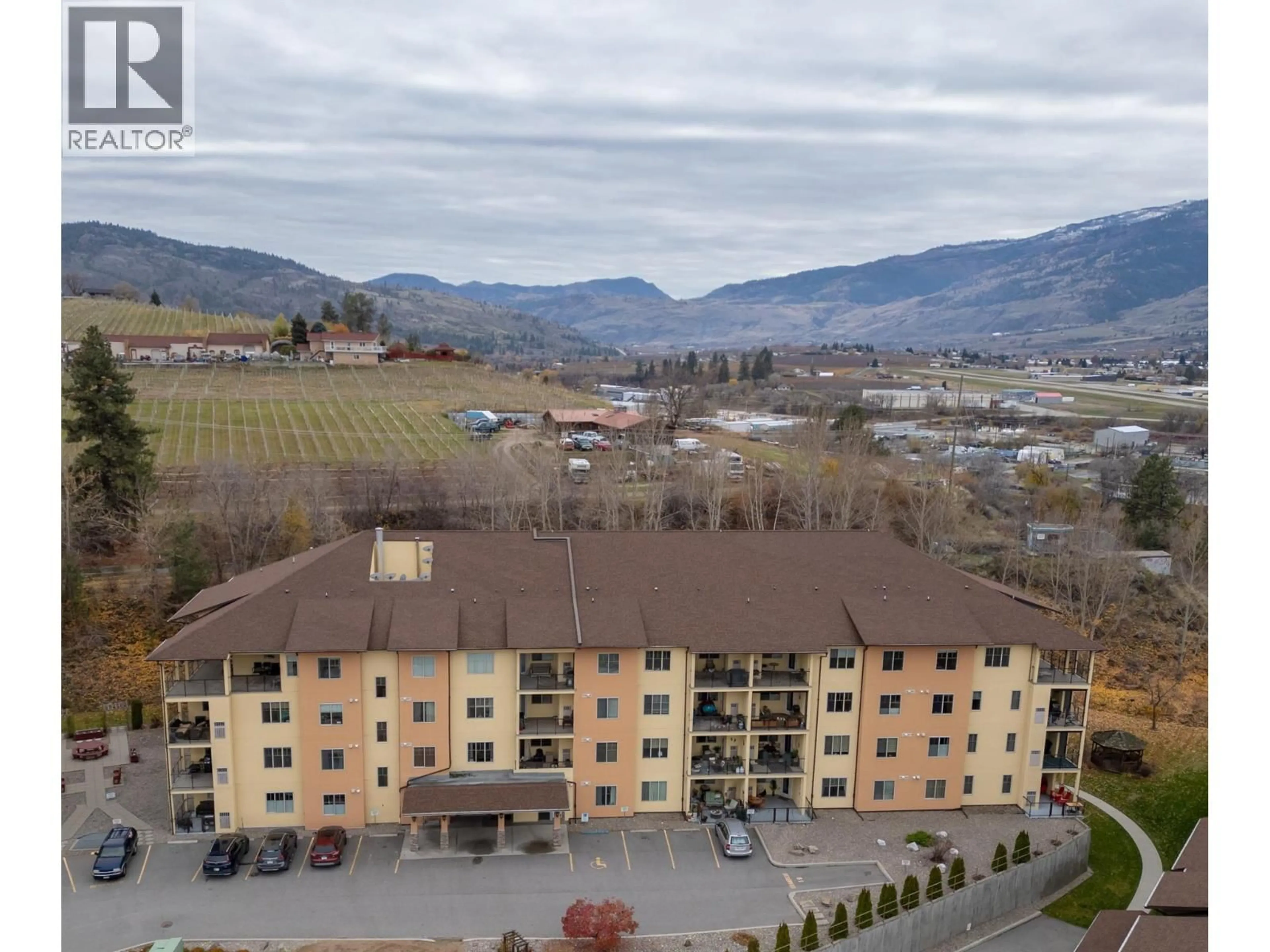 A pic from outside/outdoor area/front of a property/back of a property/a pic from drone, mountain view for 102B - 921 SPILLWAY ROAD, Oliver British Columbia V0H1T8