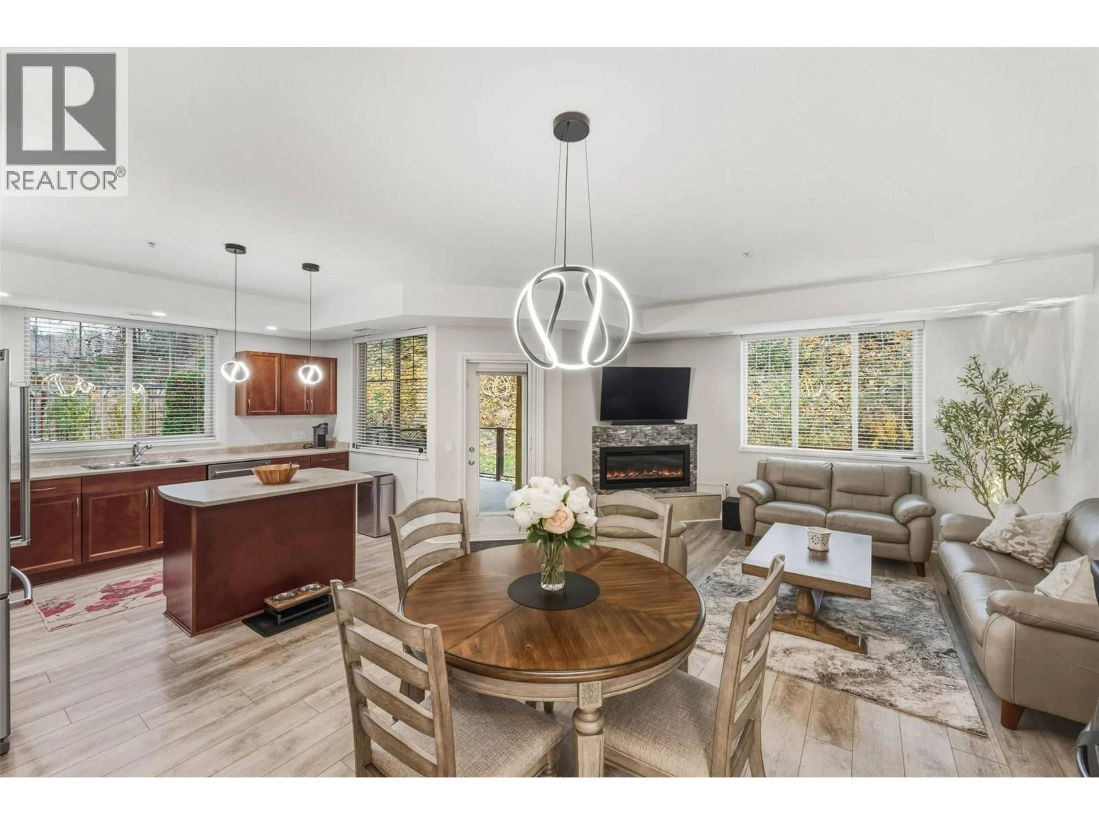 Open concept kitchen, wood/laminate floor for 102B - 921 SPILLWAY ROAD, Oliver British Columbia V0H1T8